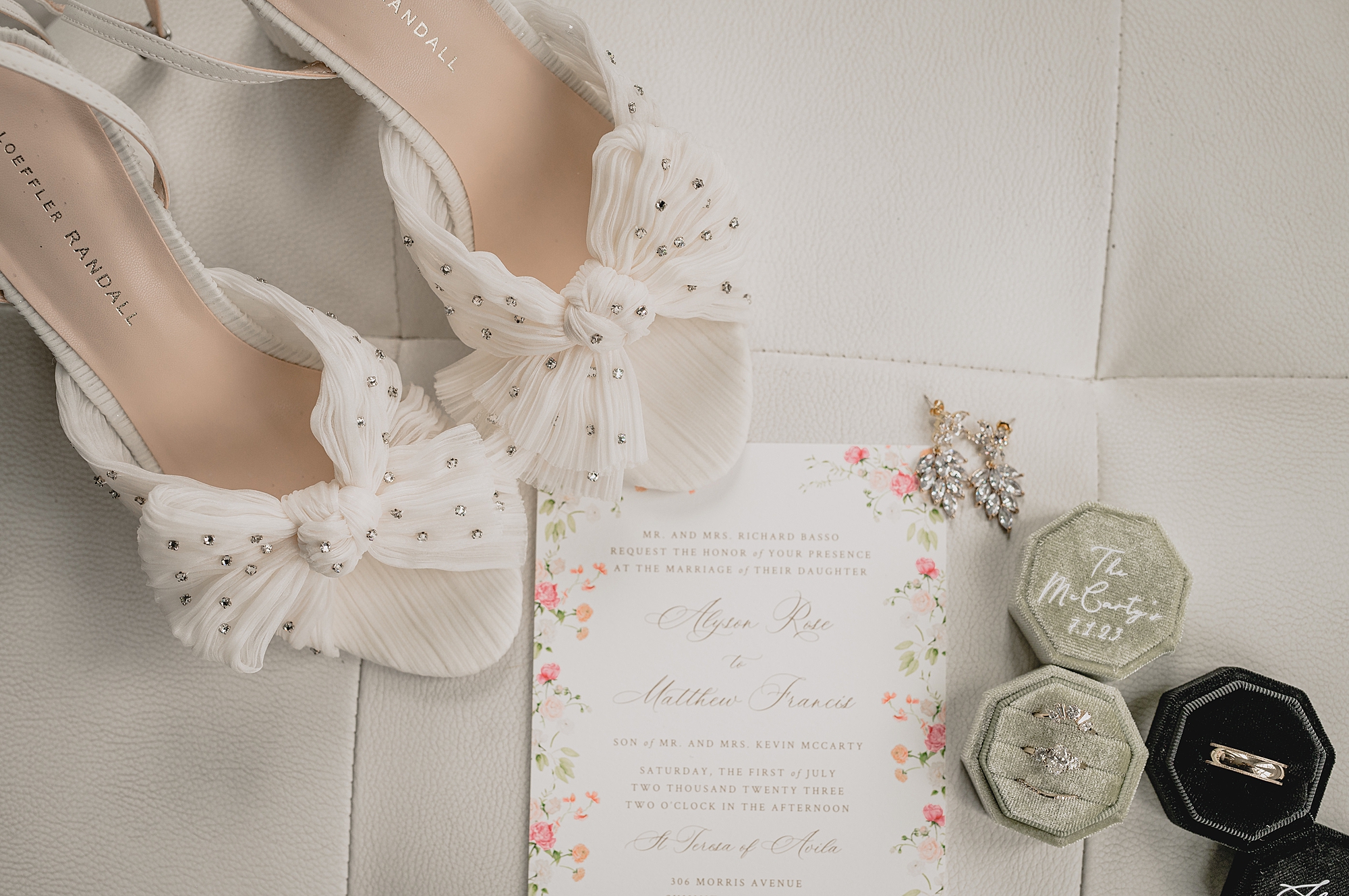 bride's shoes with white bow with gold polka dots