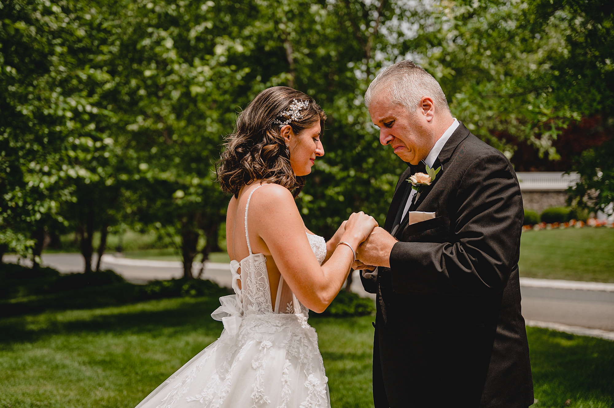 dad cries looking at bride in her wedding gown