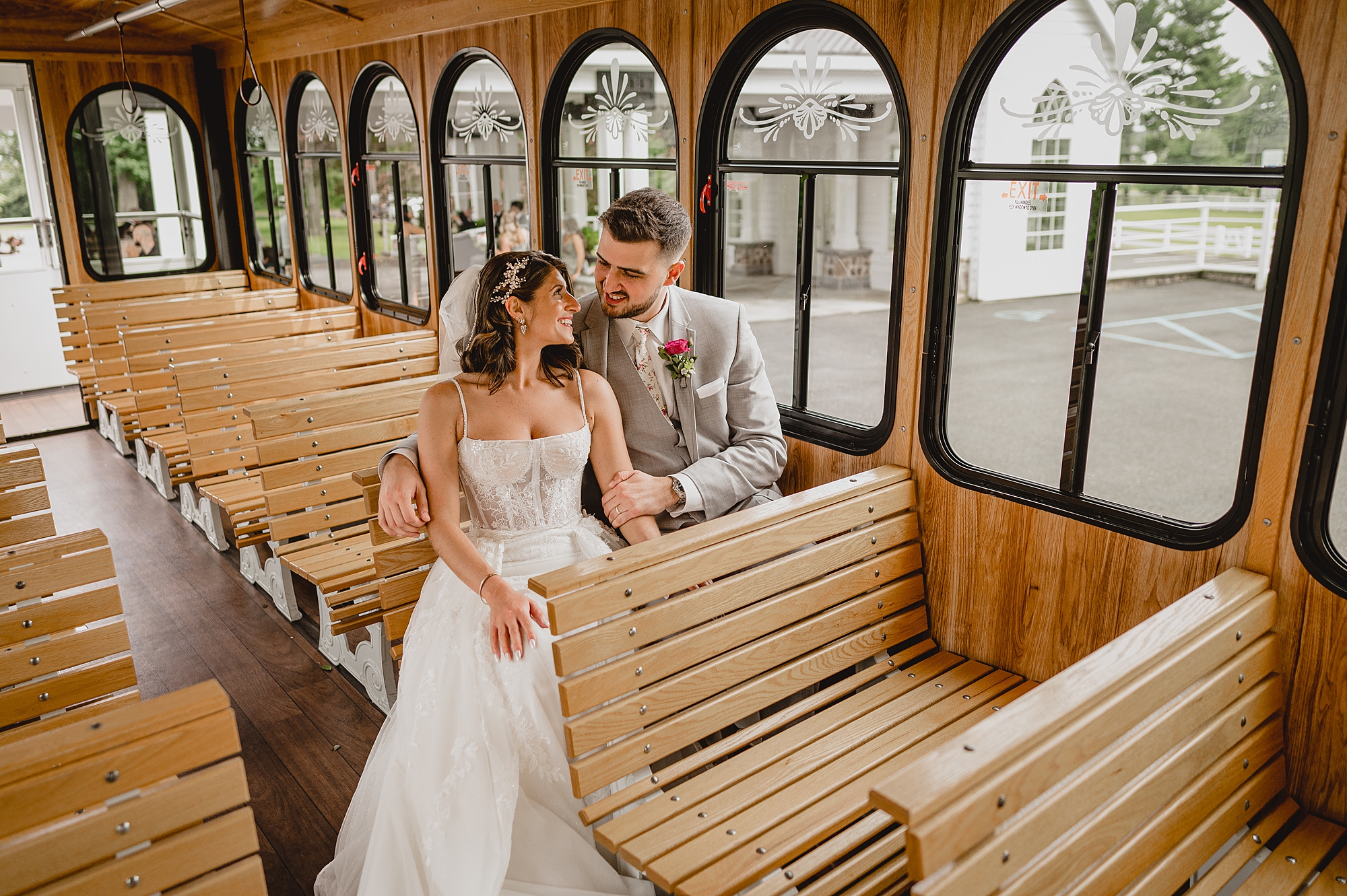 bride and groom sit together on trolley in New Jersey