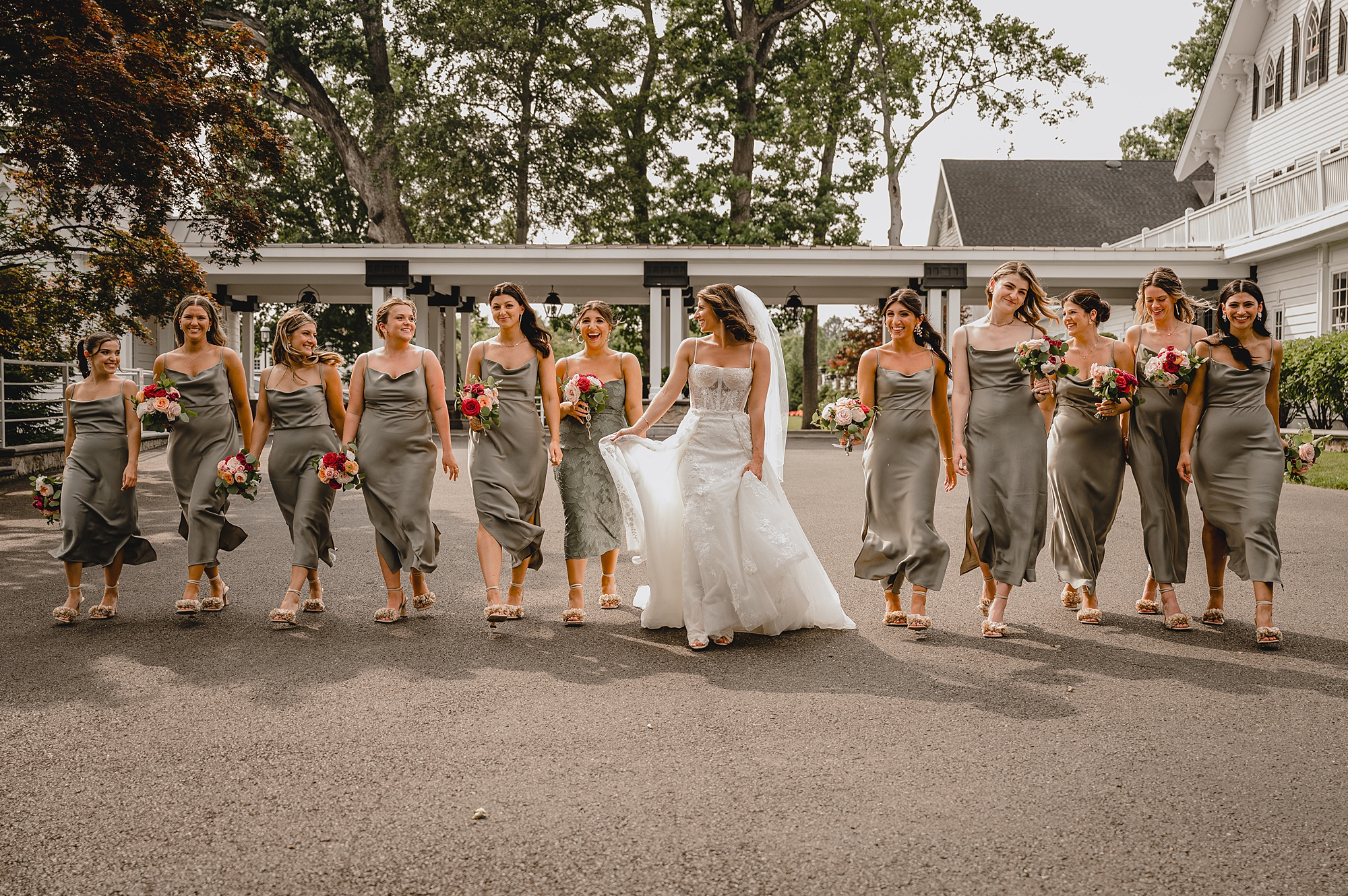 bride walks with bridesmaids at the Ryland Inn