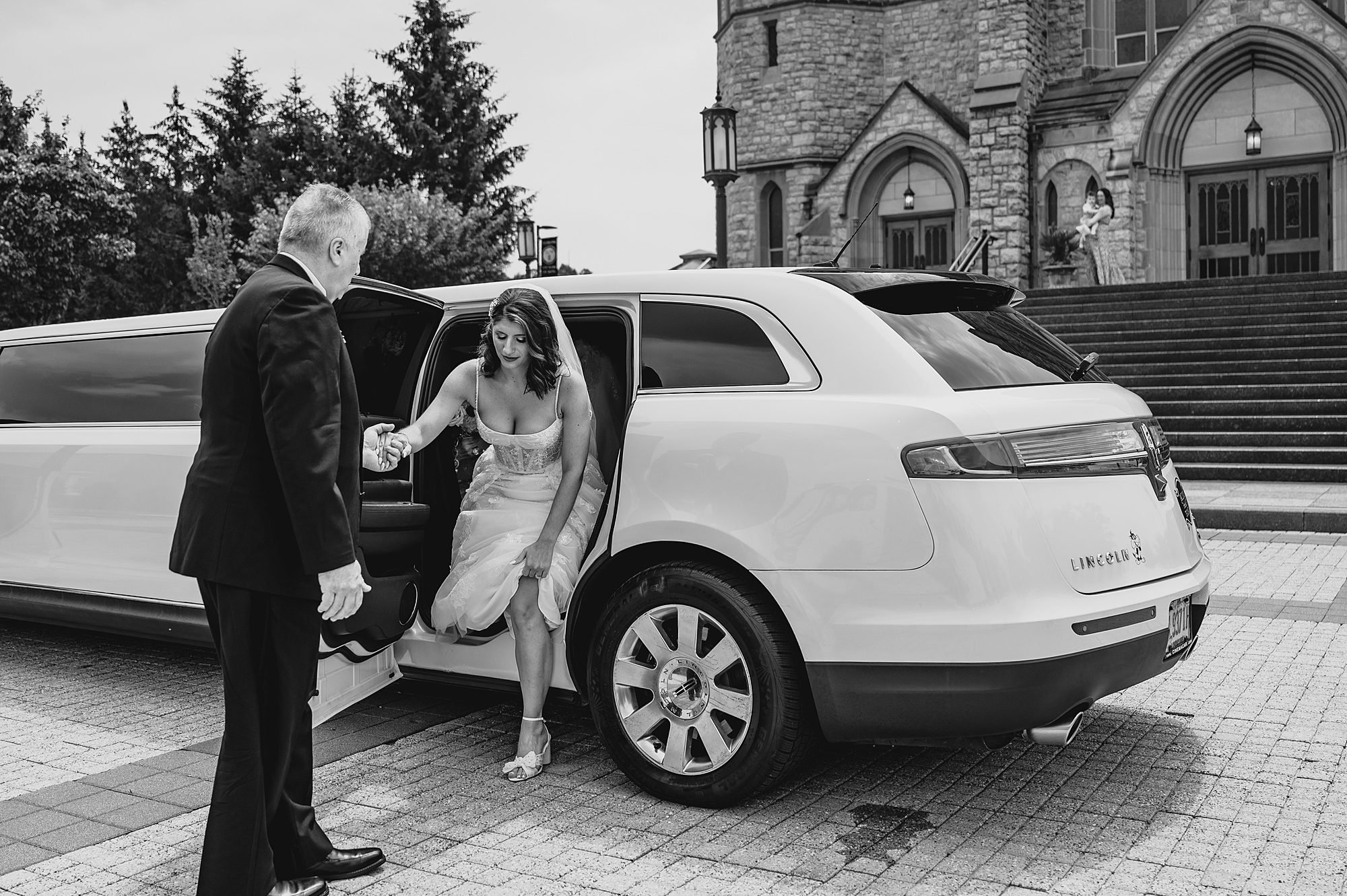 bride exits limo outside New Jersey church