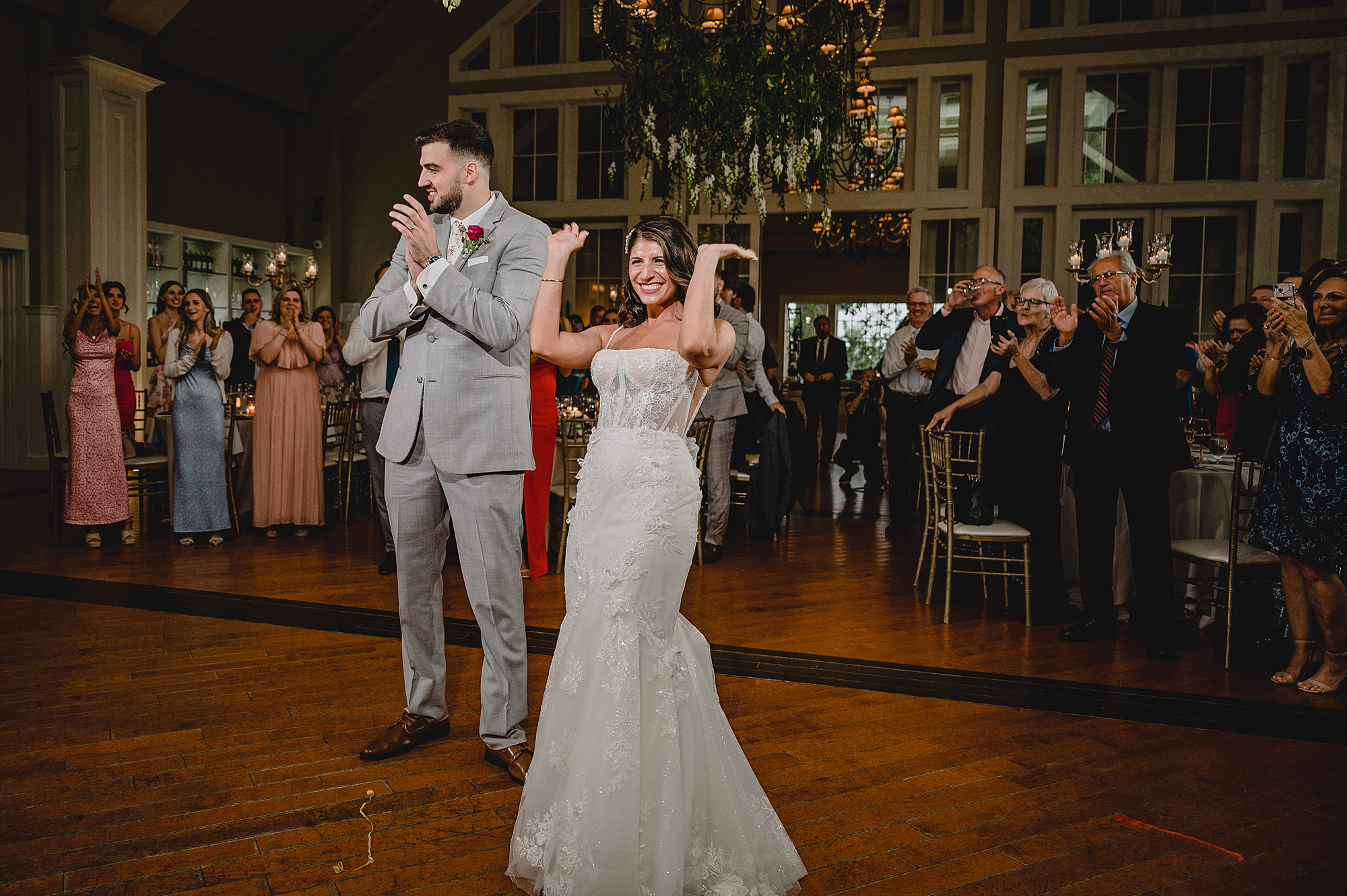 bride and groom dance together at reception