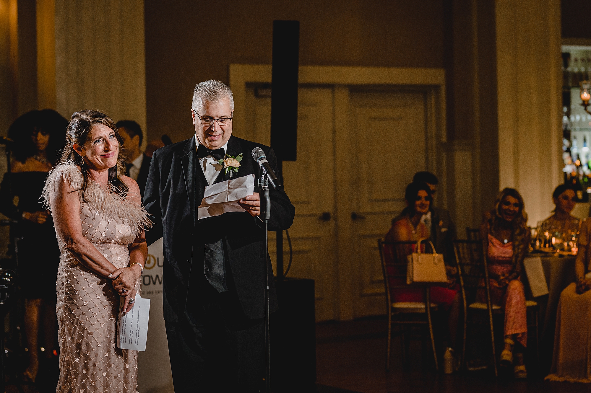 father reads speech during NJ wedding reception