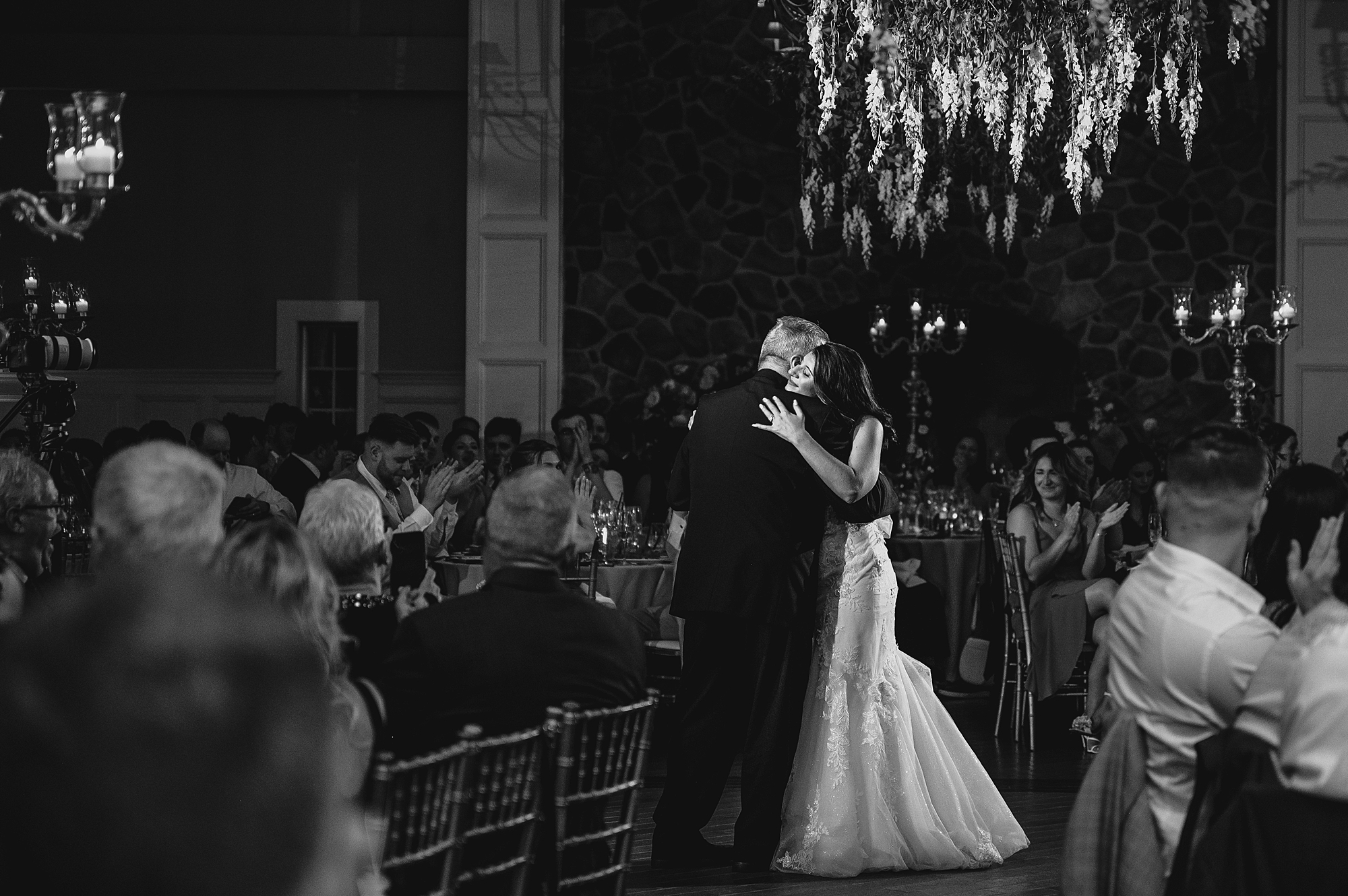 bride smiles up at dad during dance at the Ryland Inn