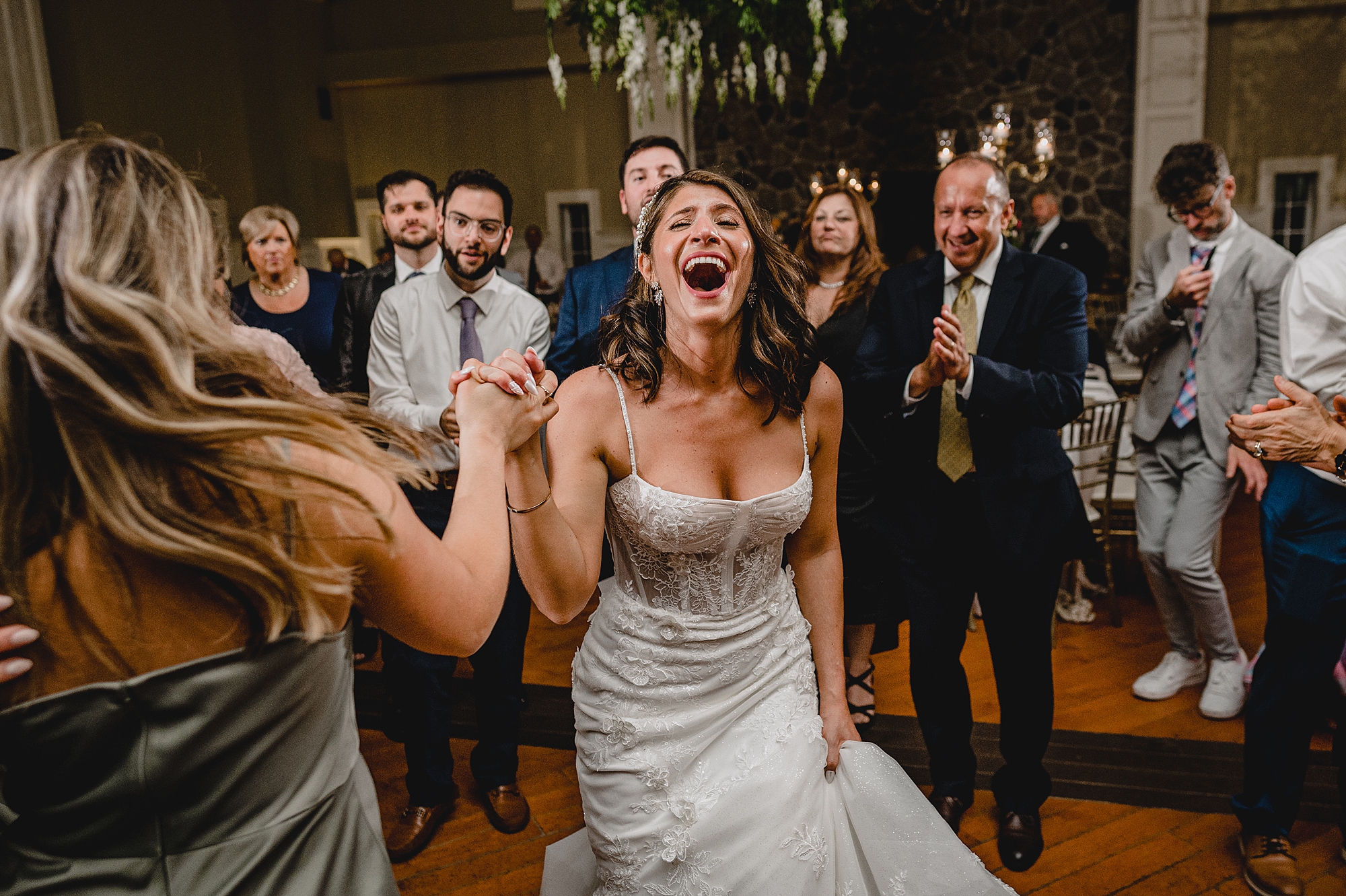 bride laughs dancing during wedding reception at the Ryland Inn