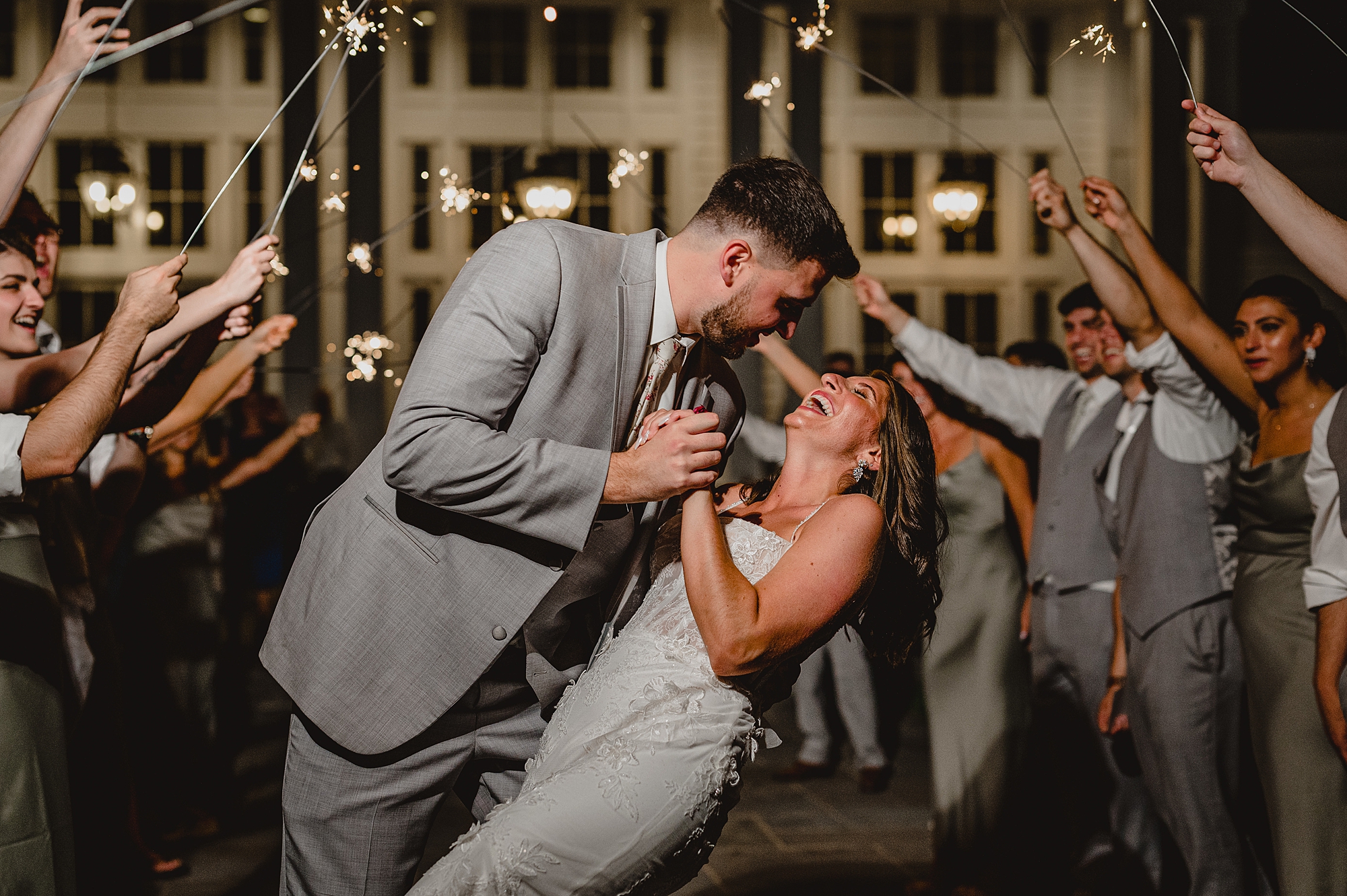 bride and groom dip during sparkler exit