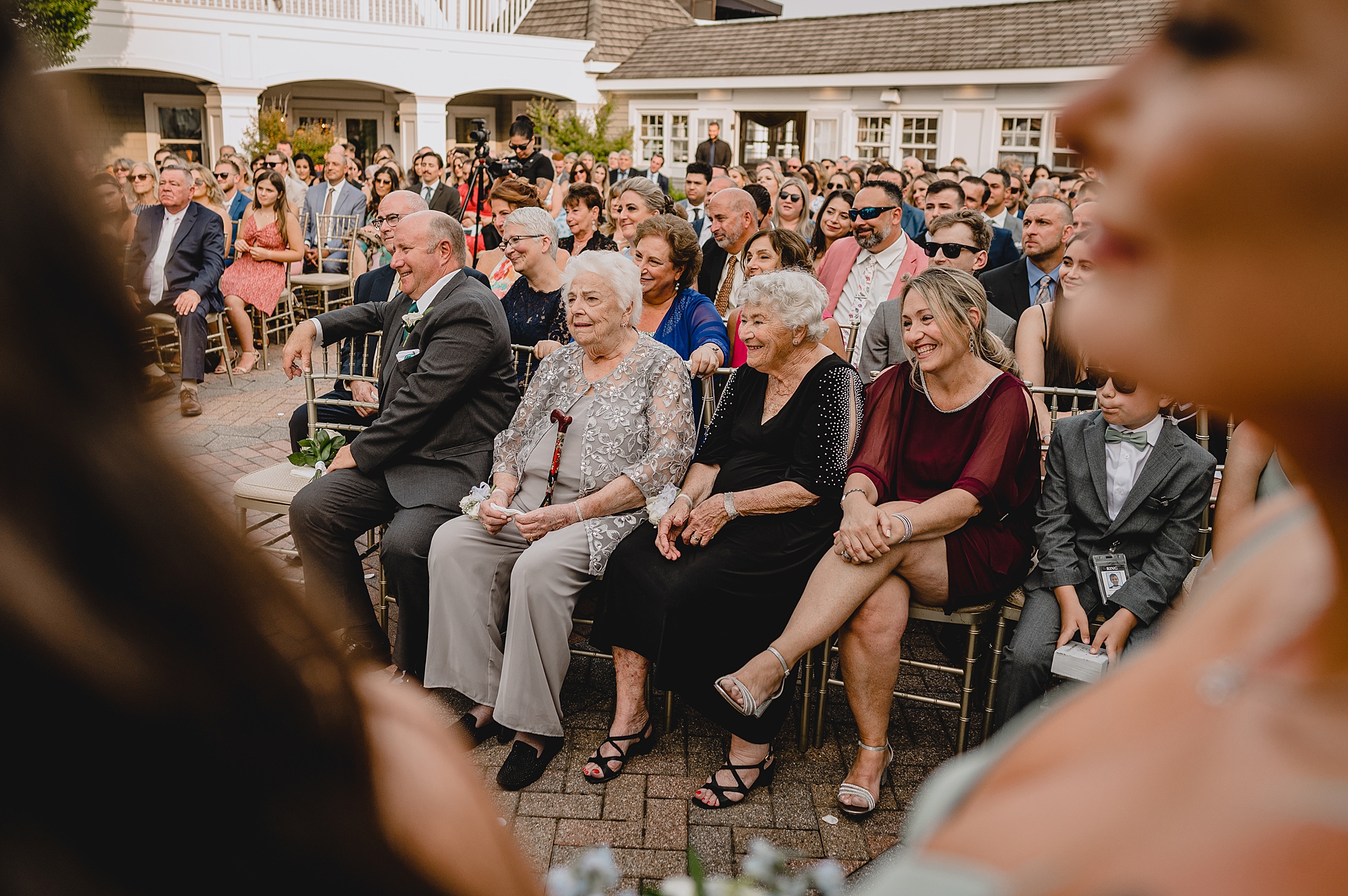 wedding guests watch the ceremony at Bridgeview Yacht Club