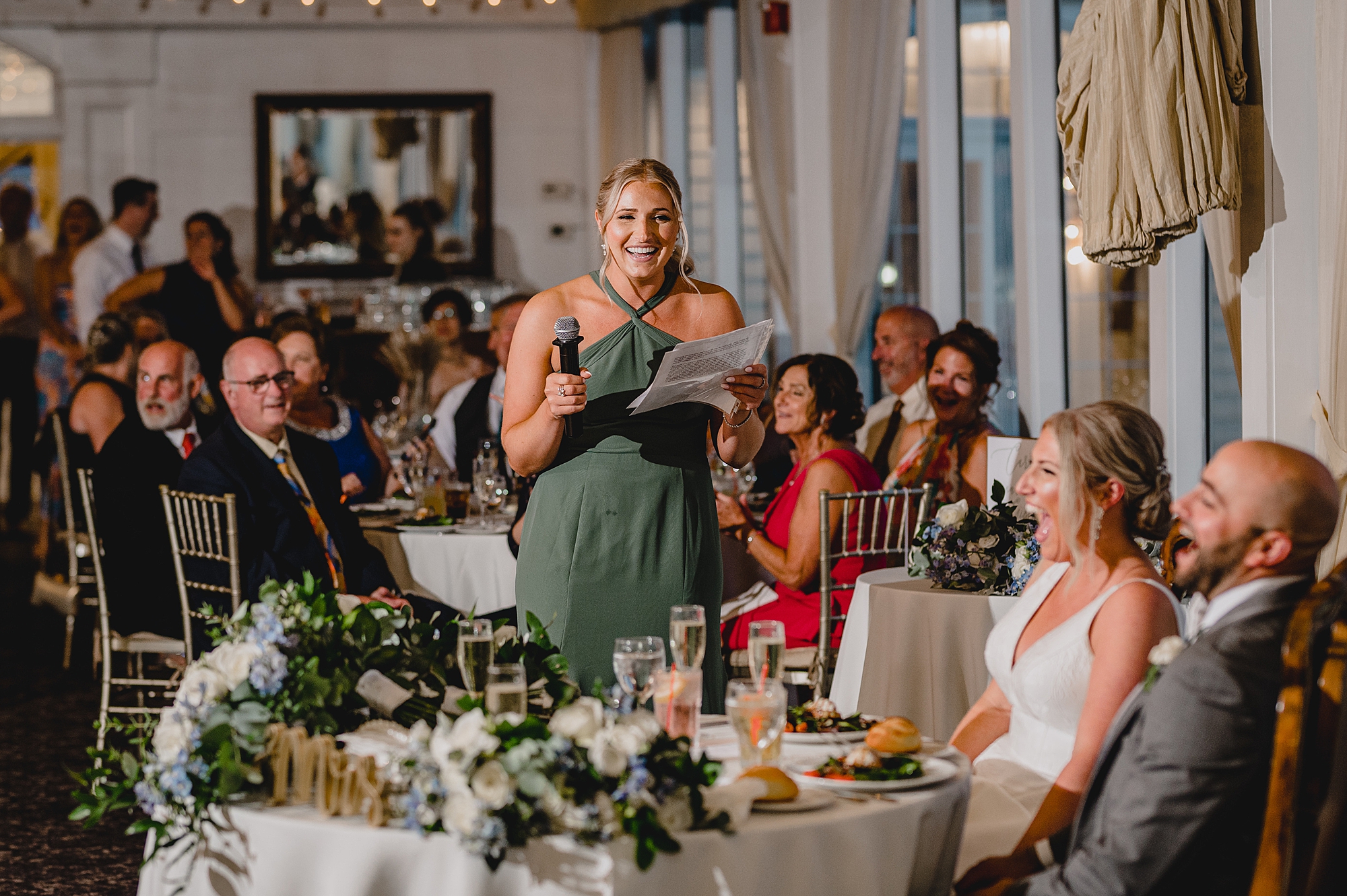 maid of honor gives toast during Island Park wedding reception