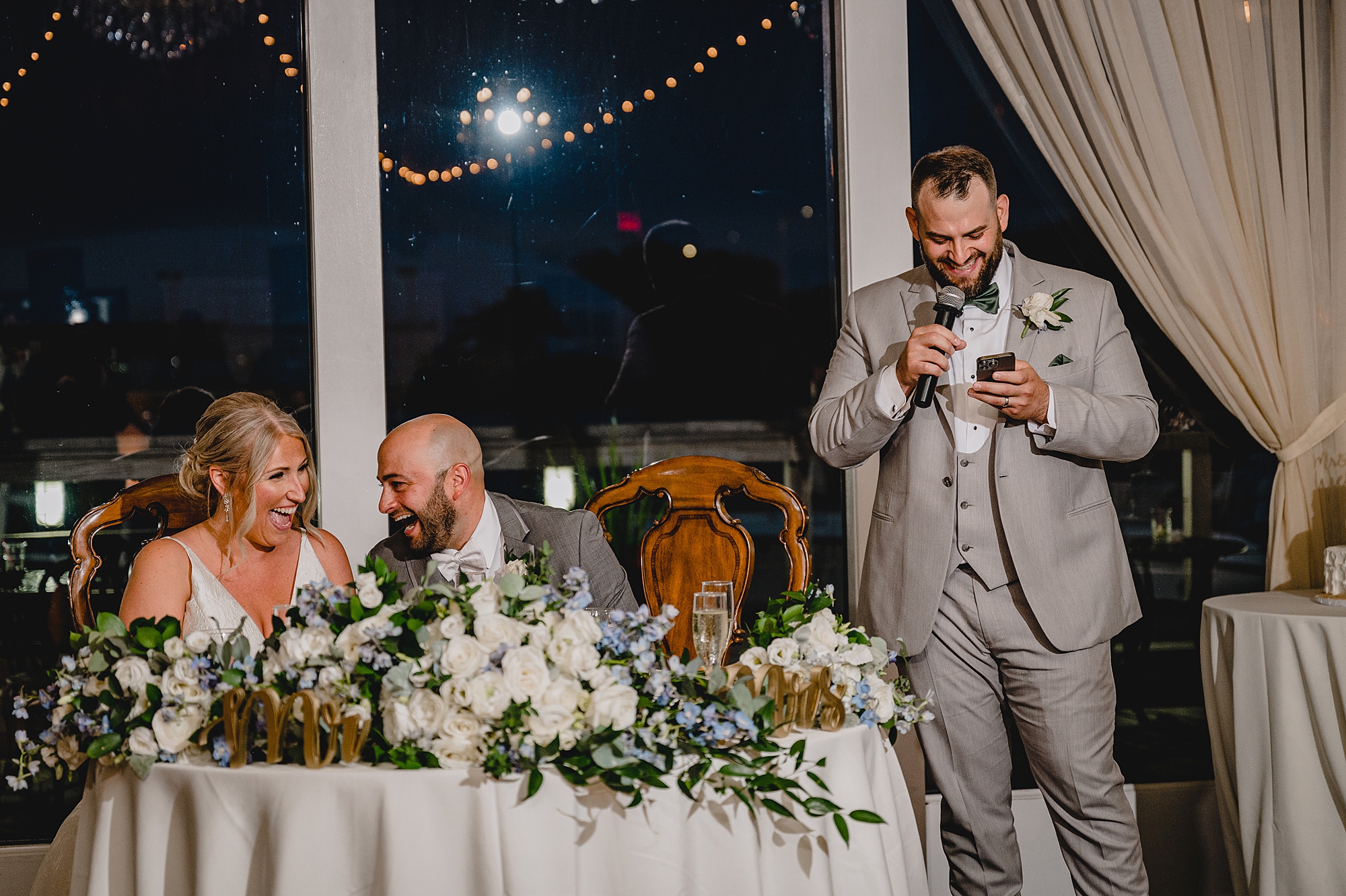 best man reads speech during Island Park wedding reception