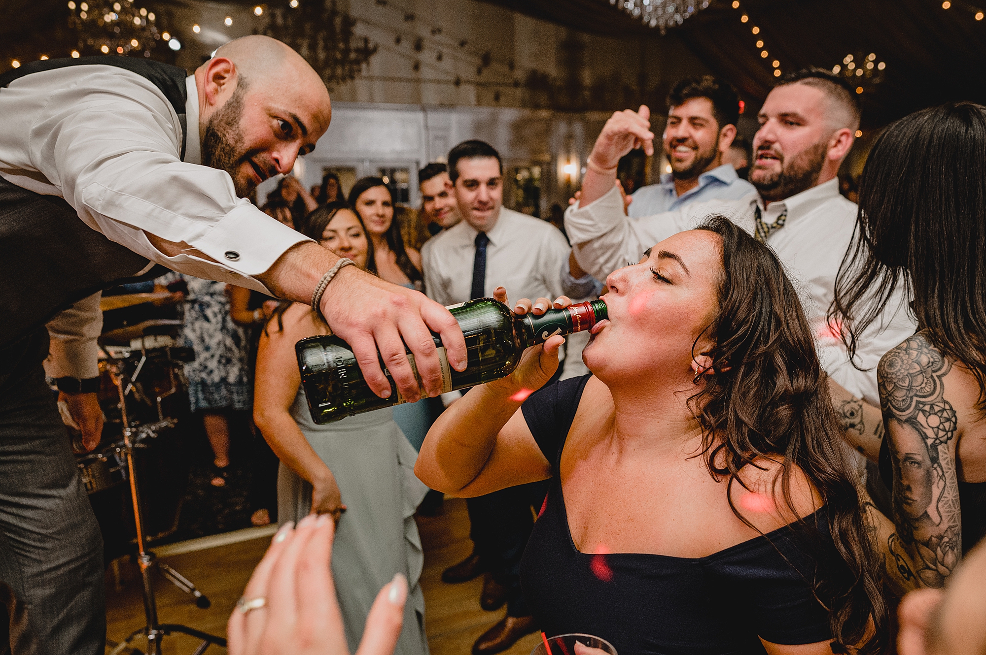 bride and groom dance with guests during wedding reception at Bridgeview Yacht Club