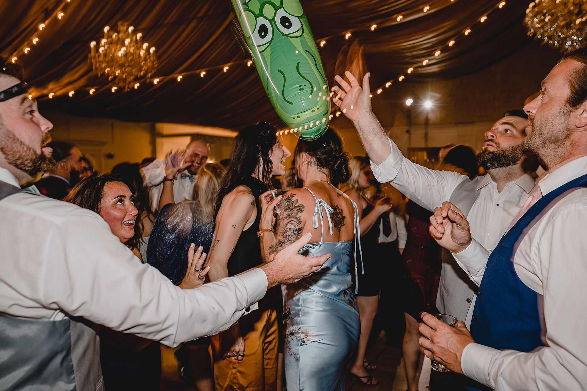 bride and groom dance with guests during wedding reception at Bridgeview Yacht Club