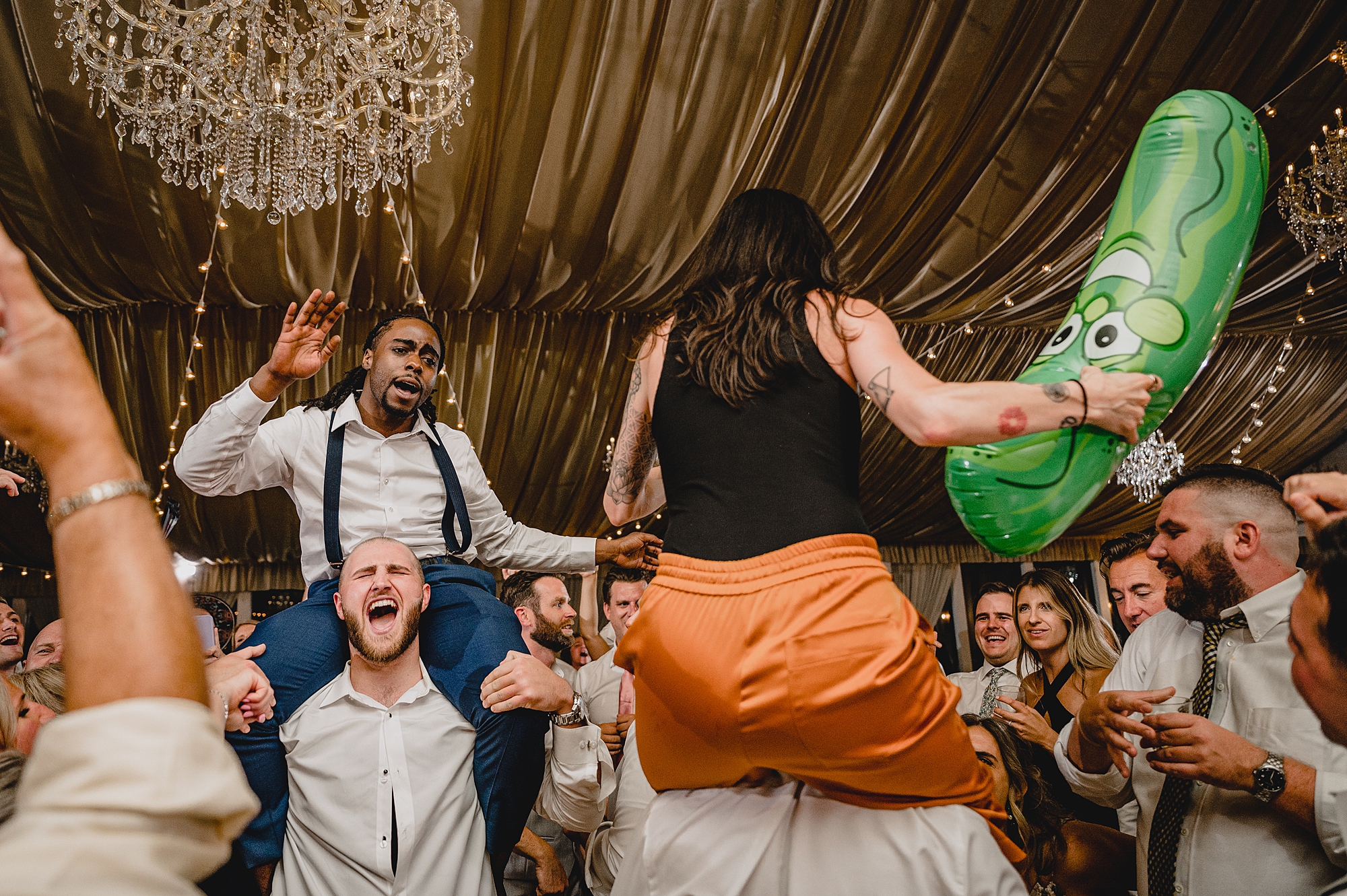 bride and groom dance with guests during wedding reception at Bridgeview Yacht Club