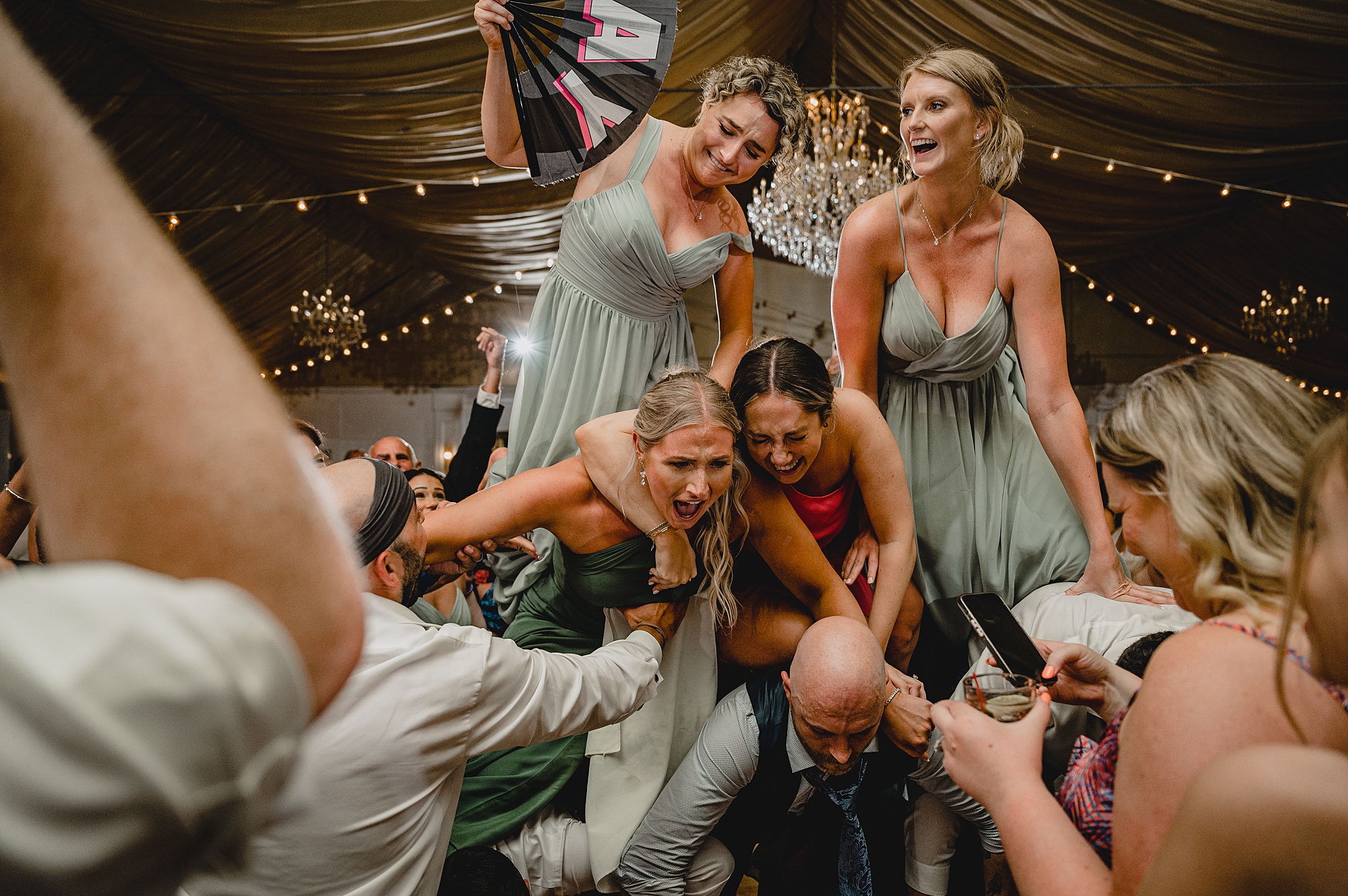 bride and groom dance with guests during wedding reception at Bridgeview Yacht Club