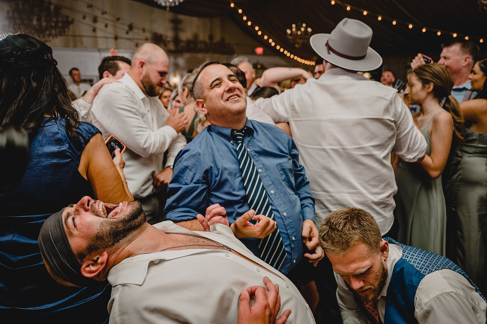 bride and groom dance with guests during wedding reception at Bridgeview Yacht Club