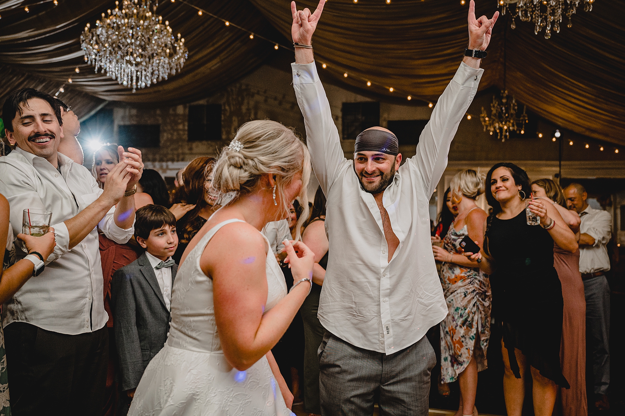 bride and groom dance with guests during wedding reception at Bridgeview Yacht Club