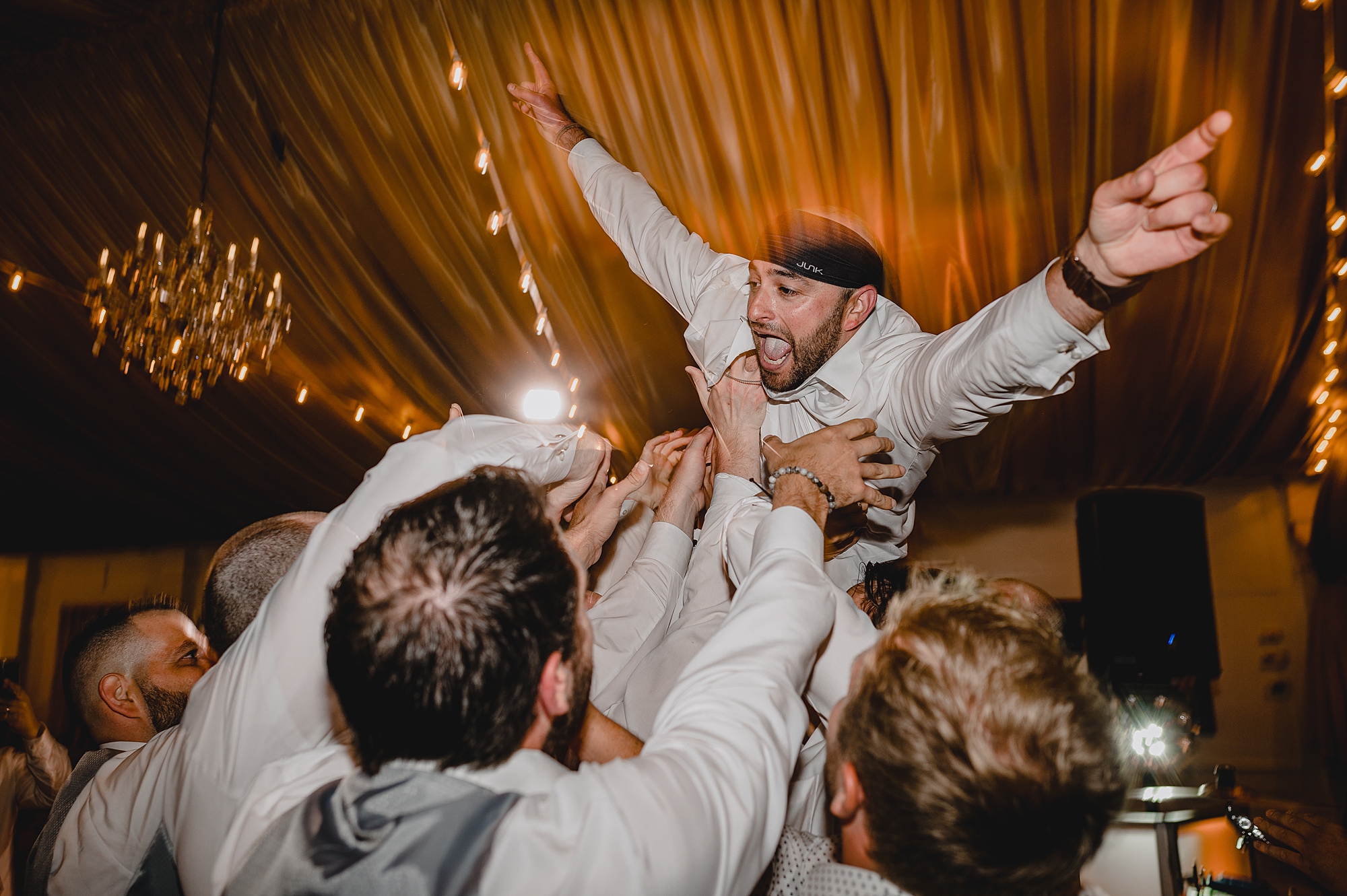 bride and groom dance with guests during wedding reception at Bridgeview Yacht Club