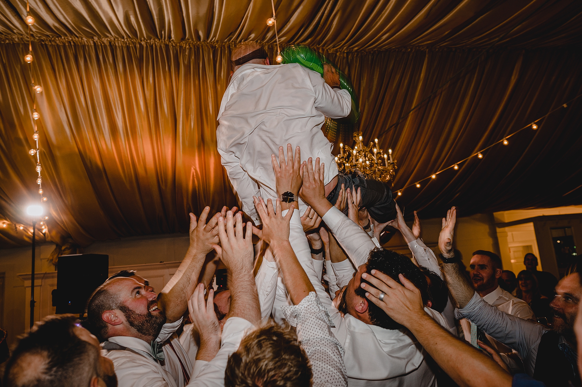 bride and groom dance with guests during wedding reception at Bridgeview Yacht Club