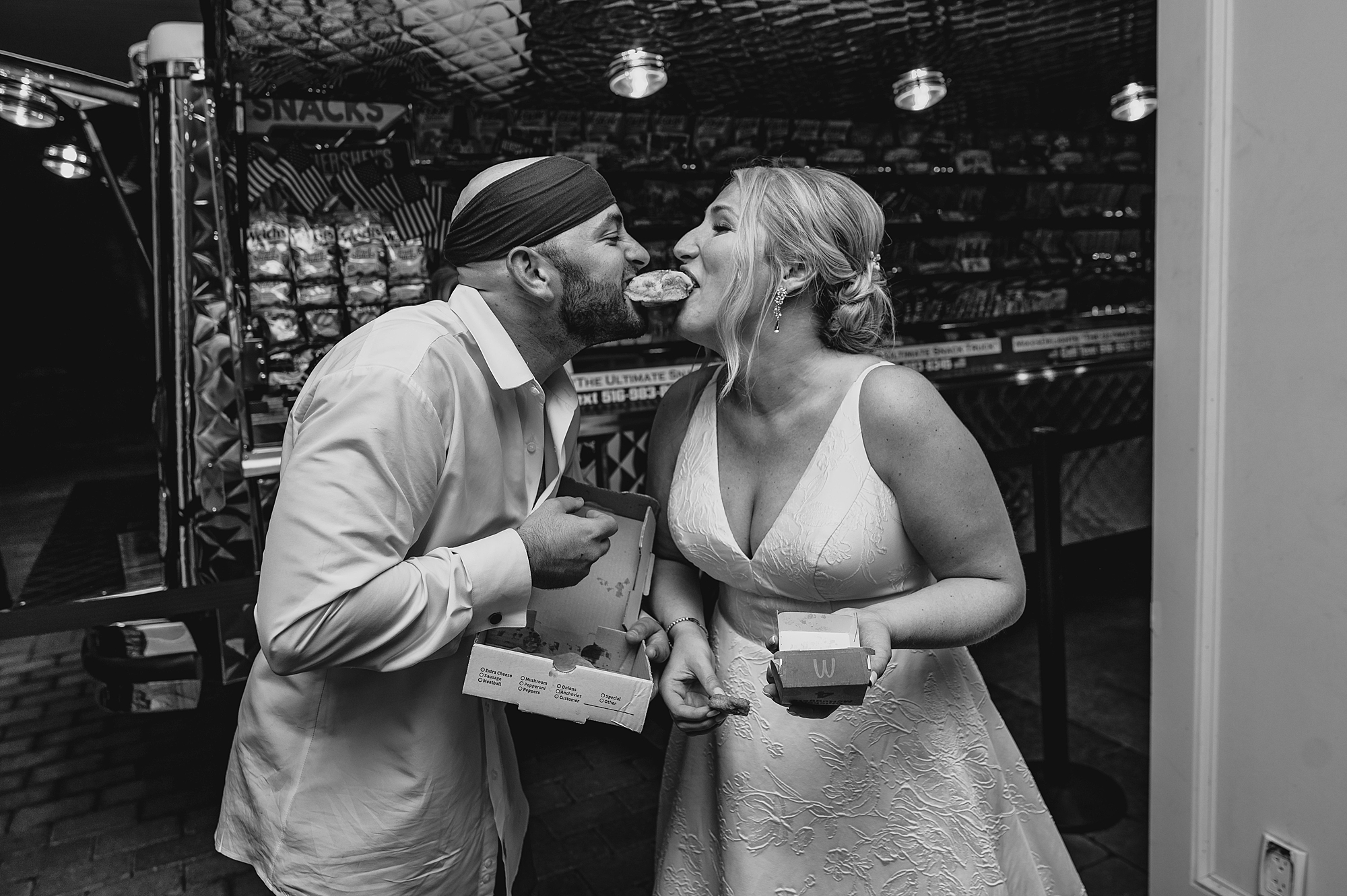newlyweds each bite side of McChicken during wedding reception