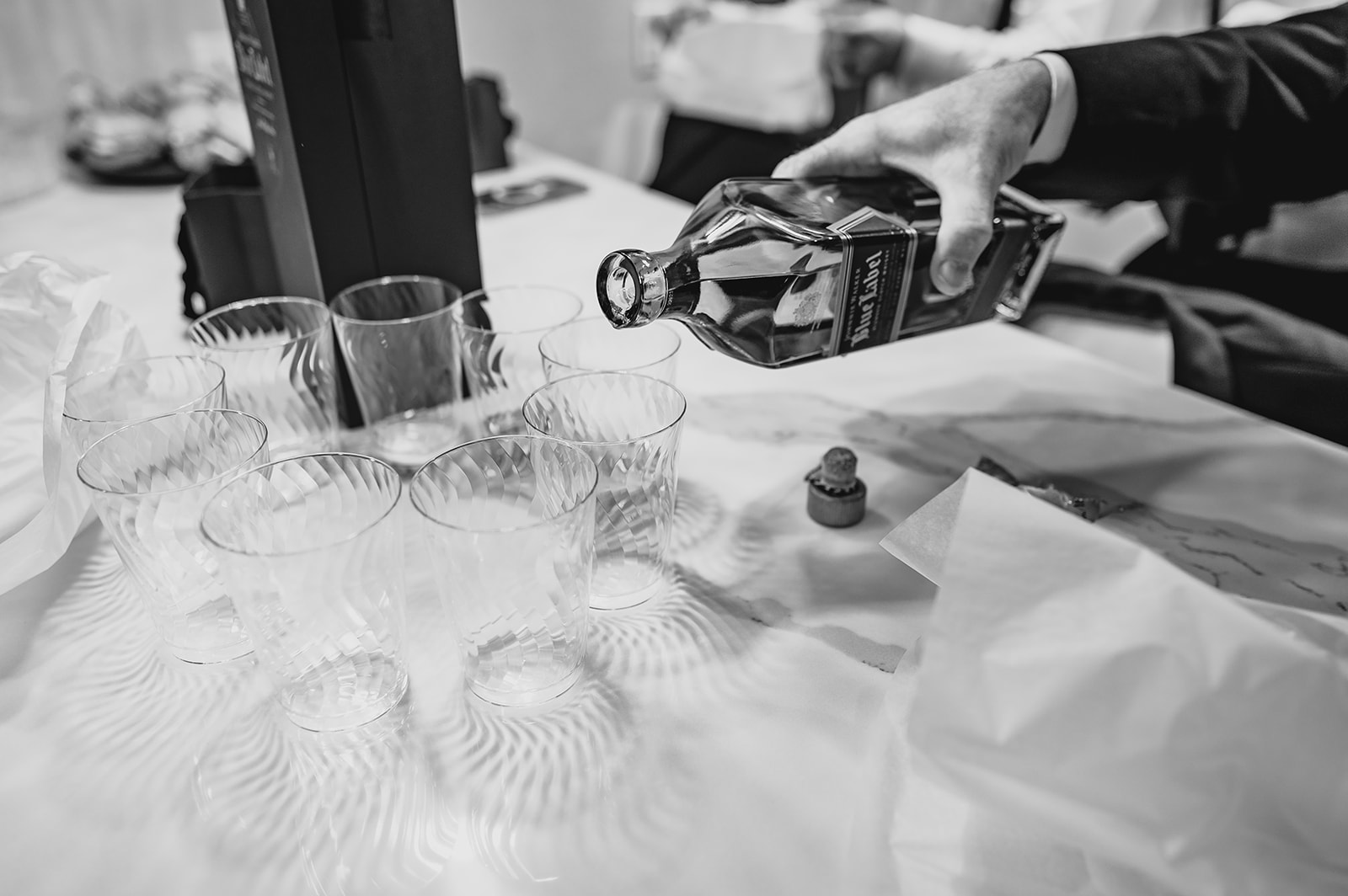 groom pours Jameson shots