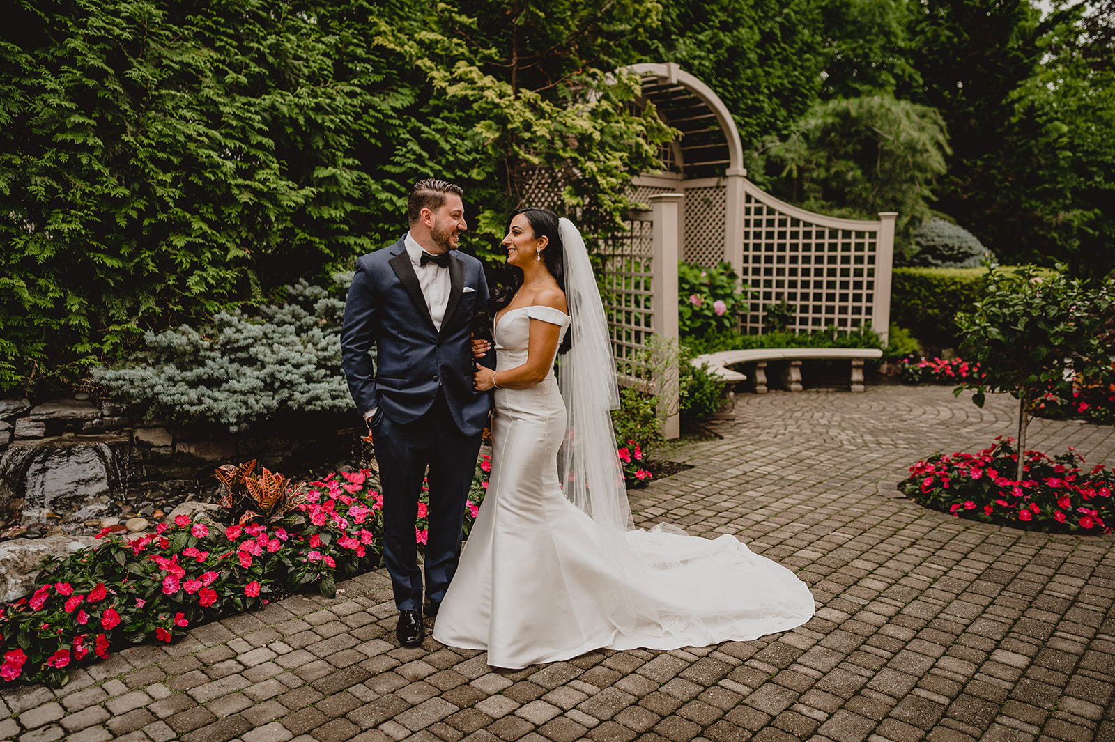 newlyweds hug in gardens of the Venetian
