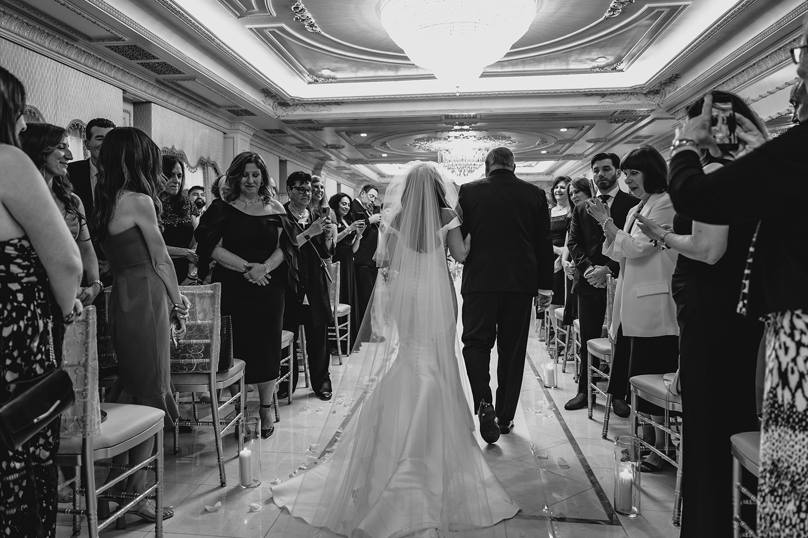 father escorts bride down the aisle for ceremony inside the Venetian