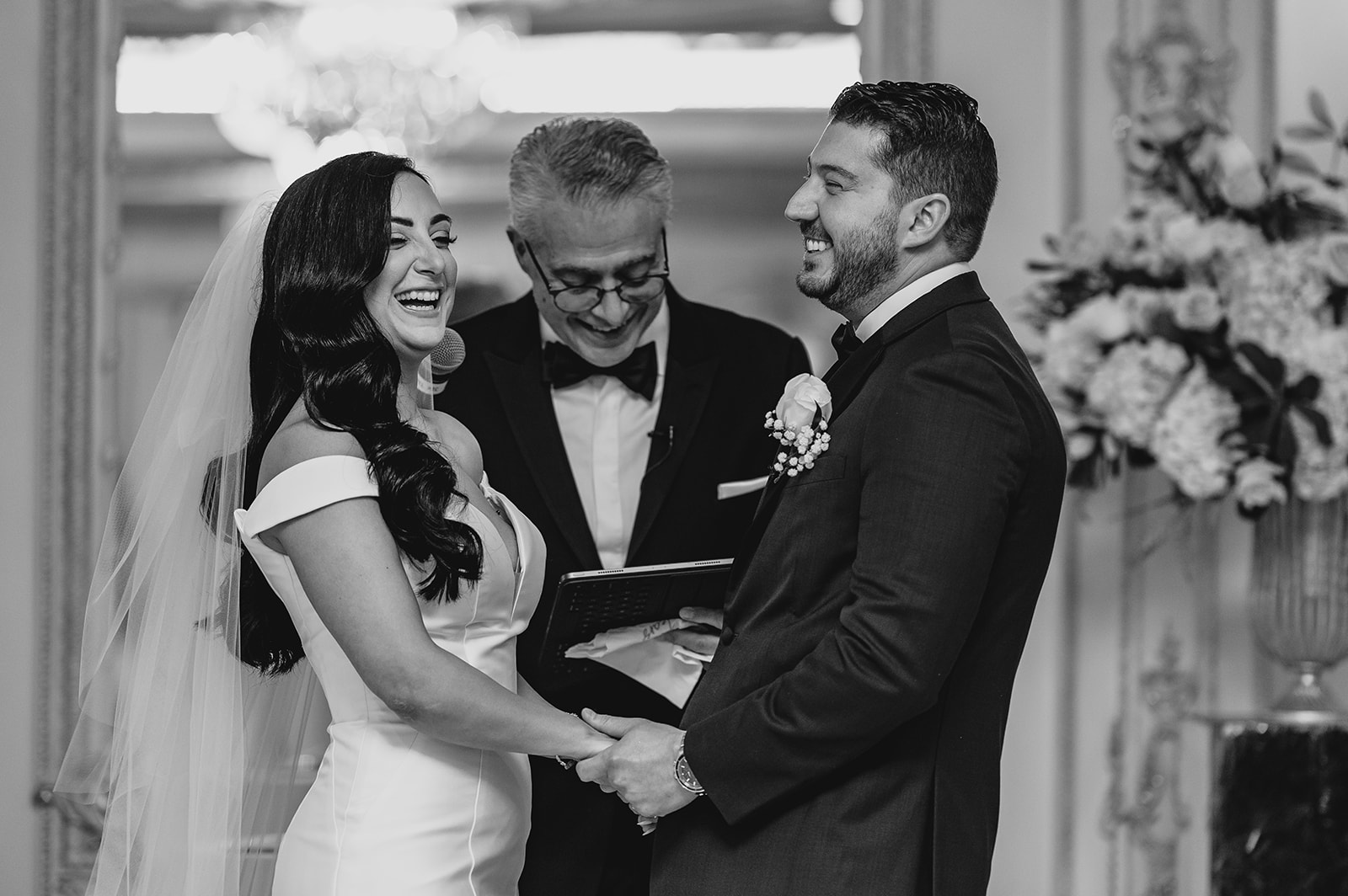 bride and groom laugh during vow exchange