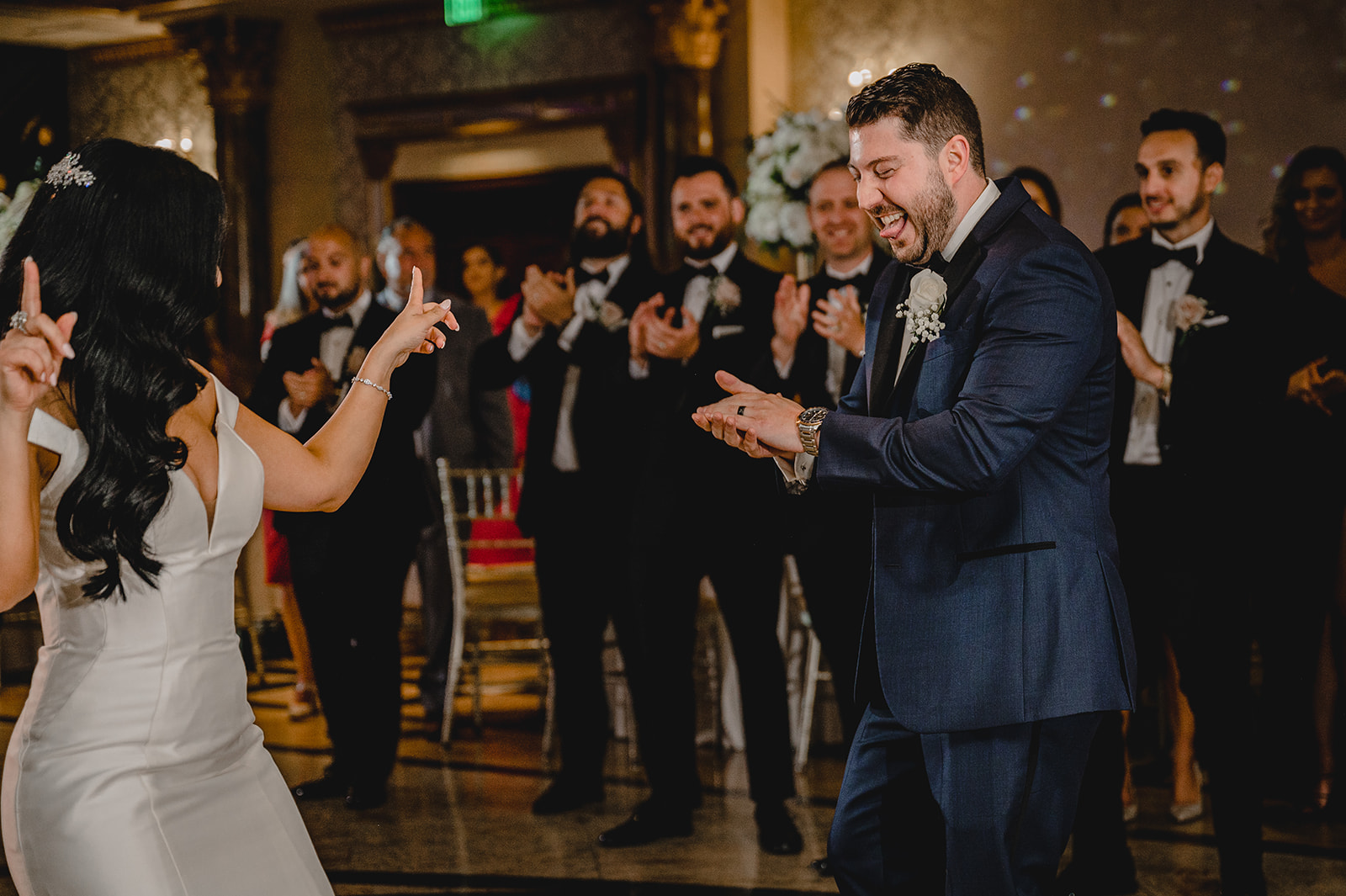 bride and groom clap walking into reception at the Venetian