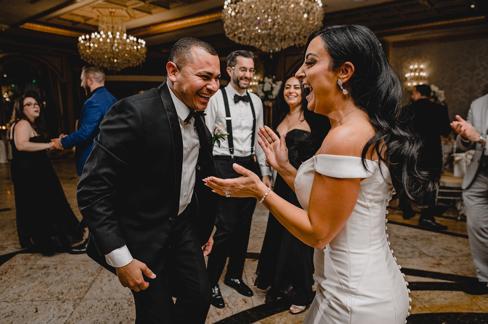 bride dances with guest during NJ wedding reception