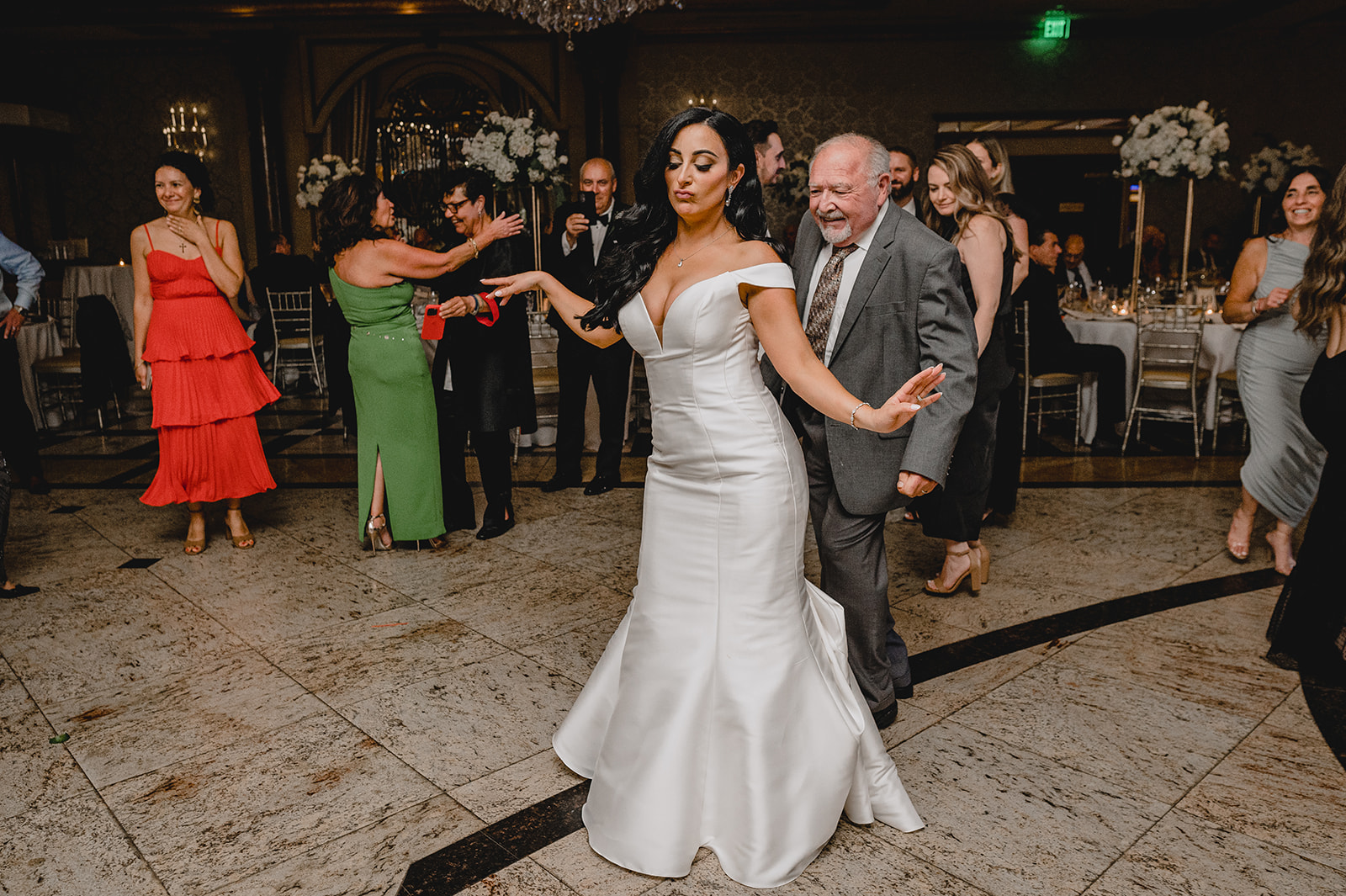 bride dances with guest during NJ wedding reception