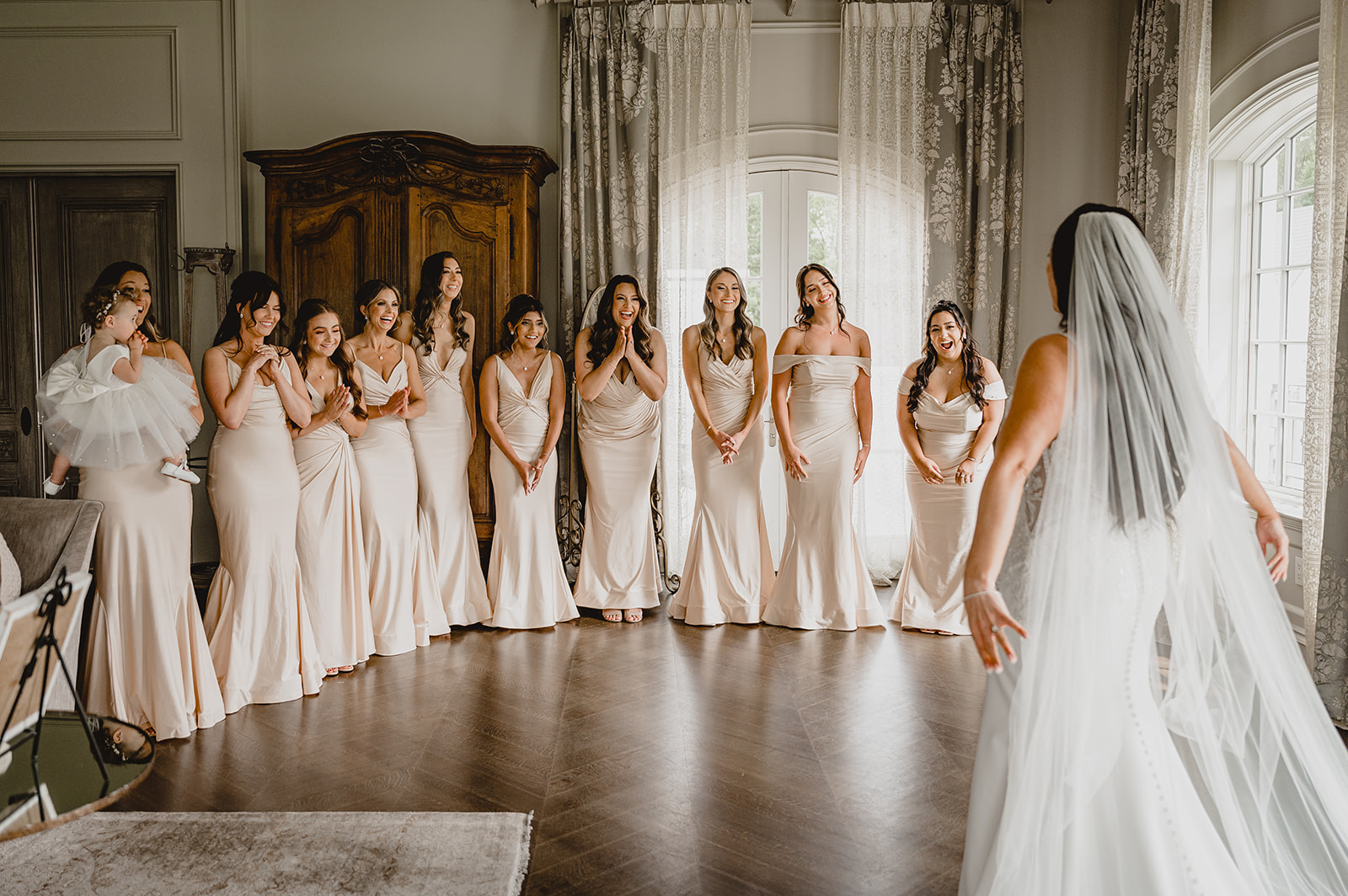 bride has first look with bridesmaids in suite at Park Chateau Estate