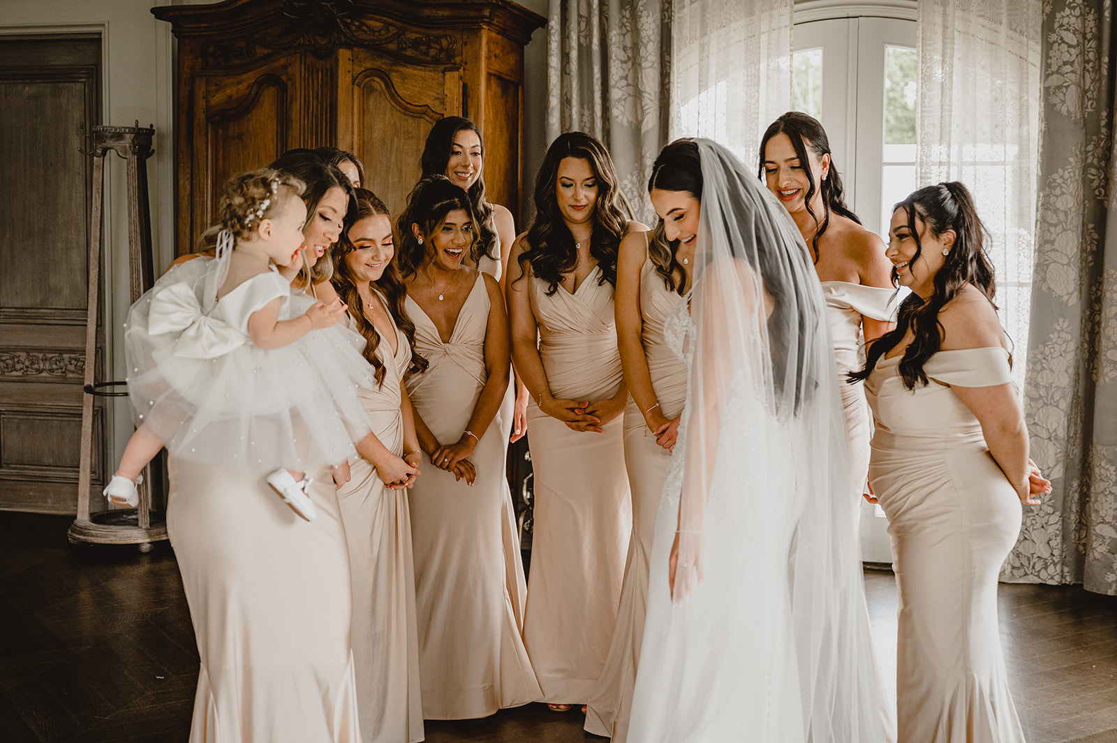 bride and bridesmaids have first look in suite at Park Chateau Estate