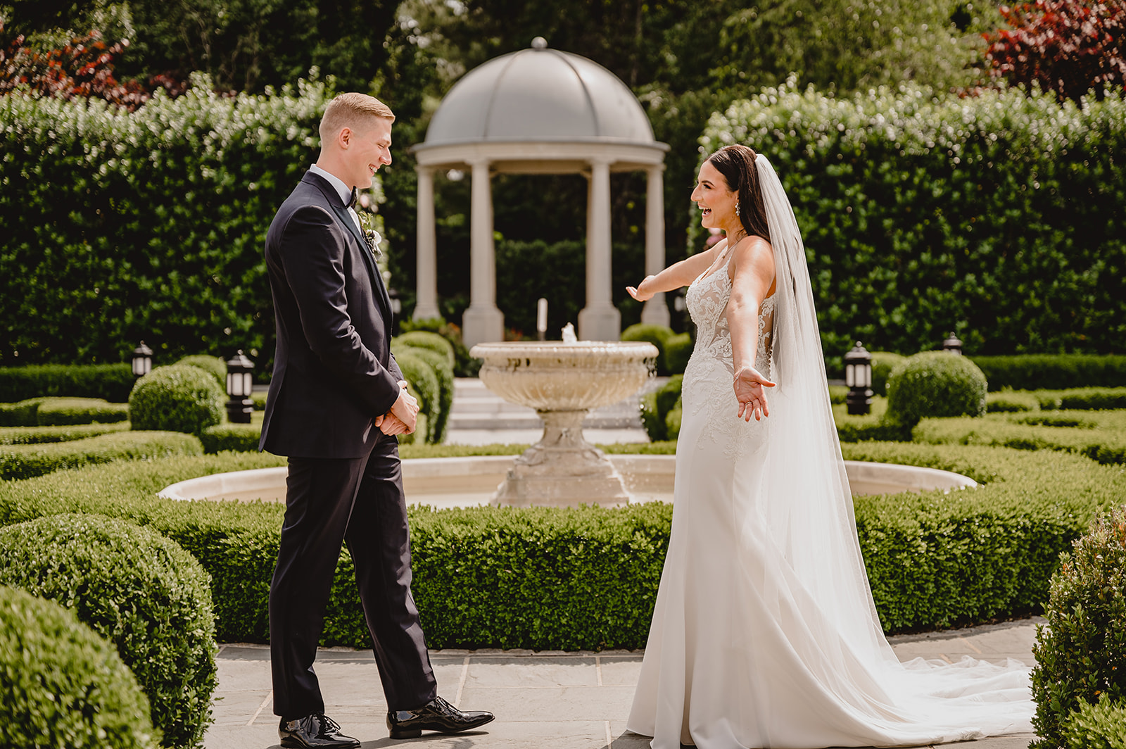 bride and groom see each other during first look at Park Chateau Estate