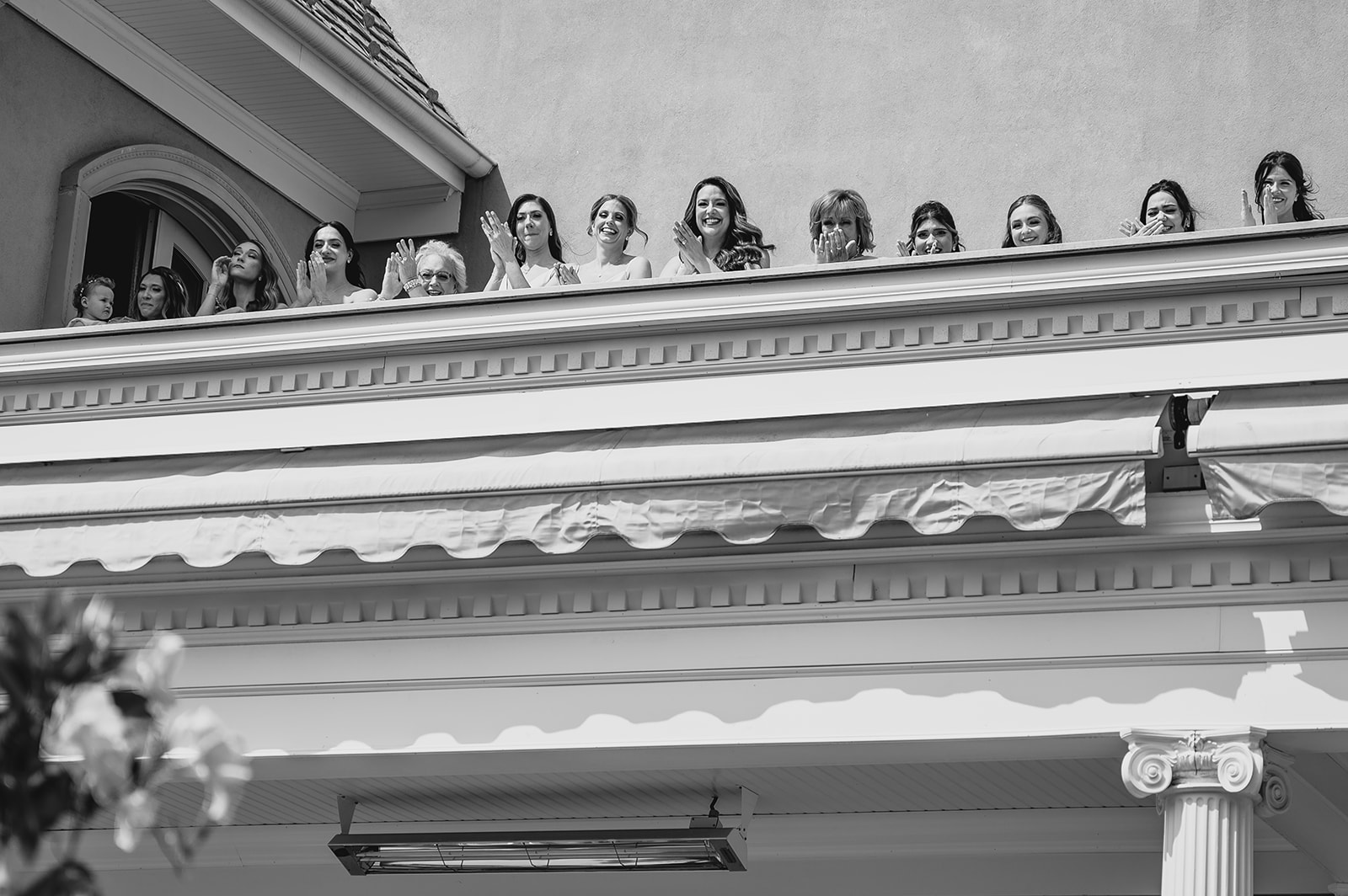 bridesmaids look over the side of Park Chateau Estate