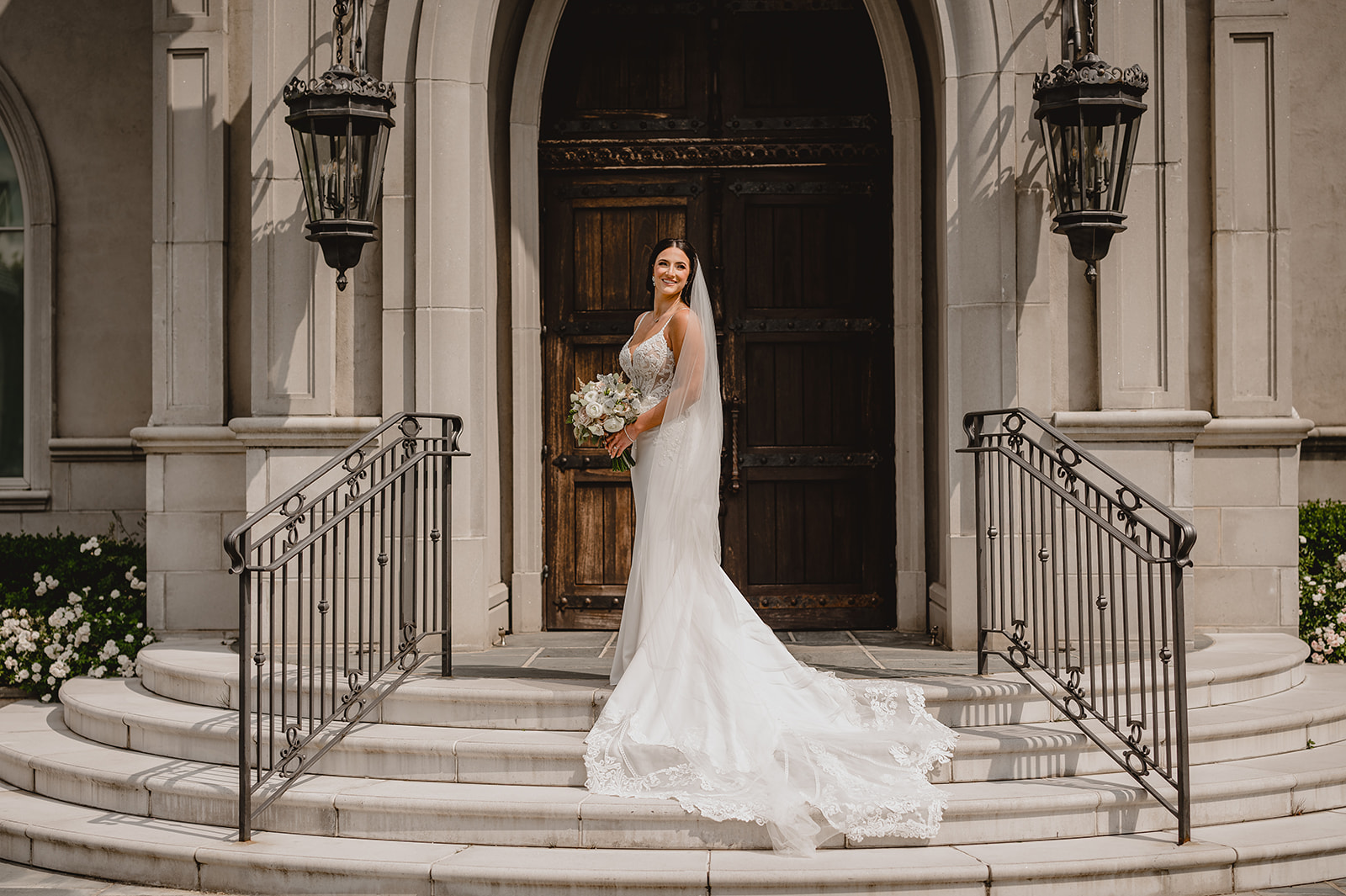 bride stands on steps of Park Chateau chapel