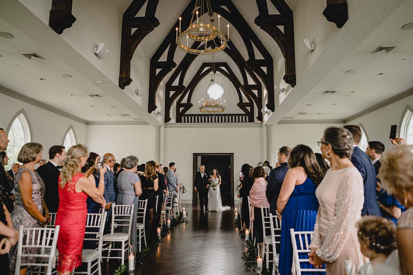 bride and father walk into chapel at Park Chateau Estate
