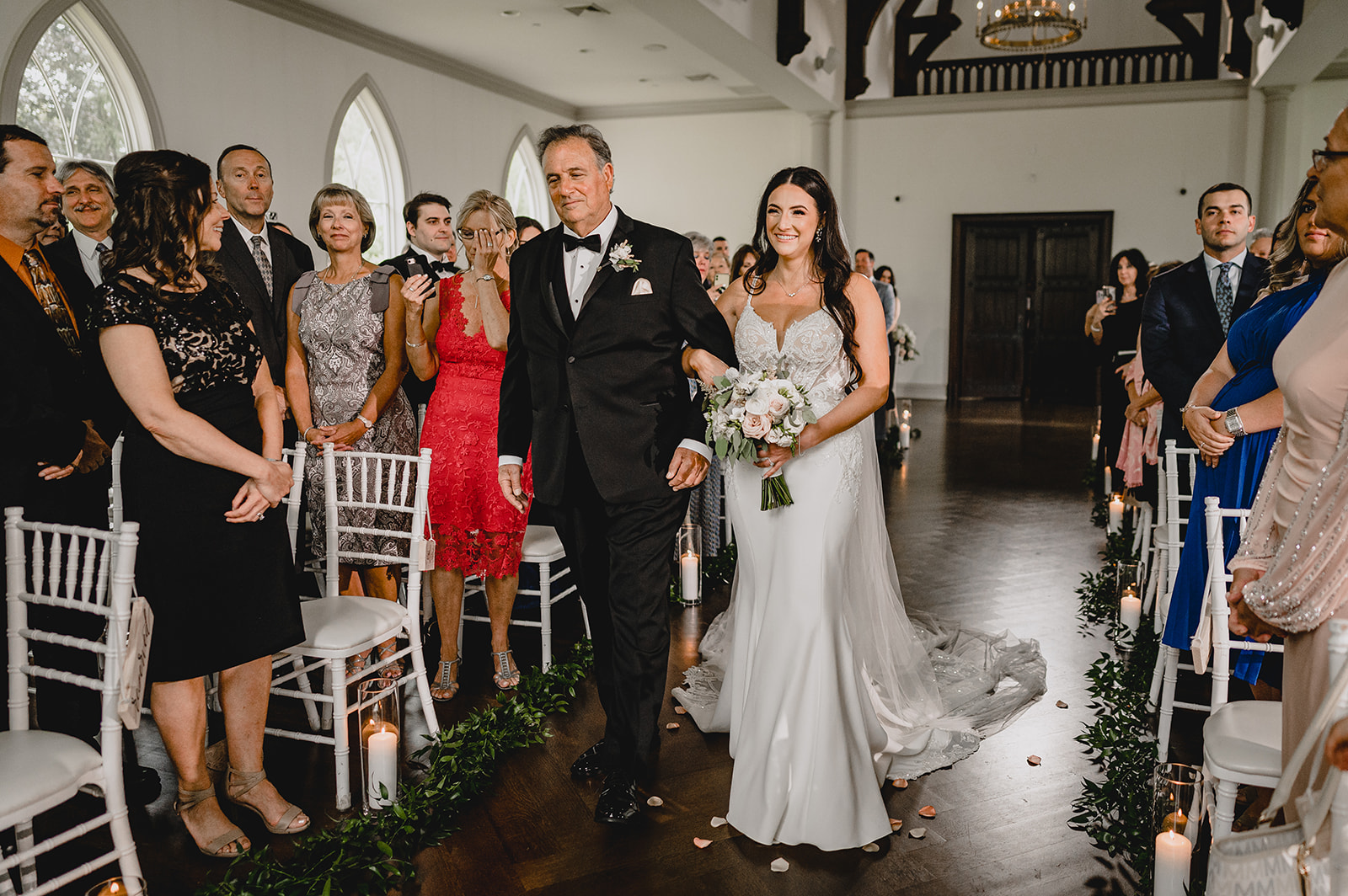 bride and father enter ceremony inside the chapel at Park Chateau Estate