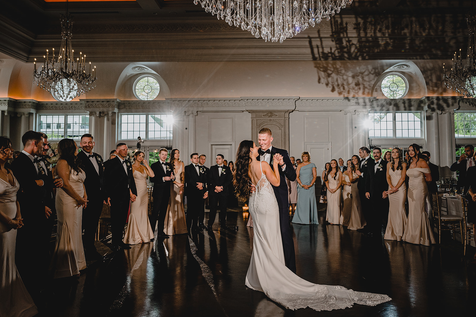bride and groom dance under chandelier at Park Chateau Estate