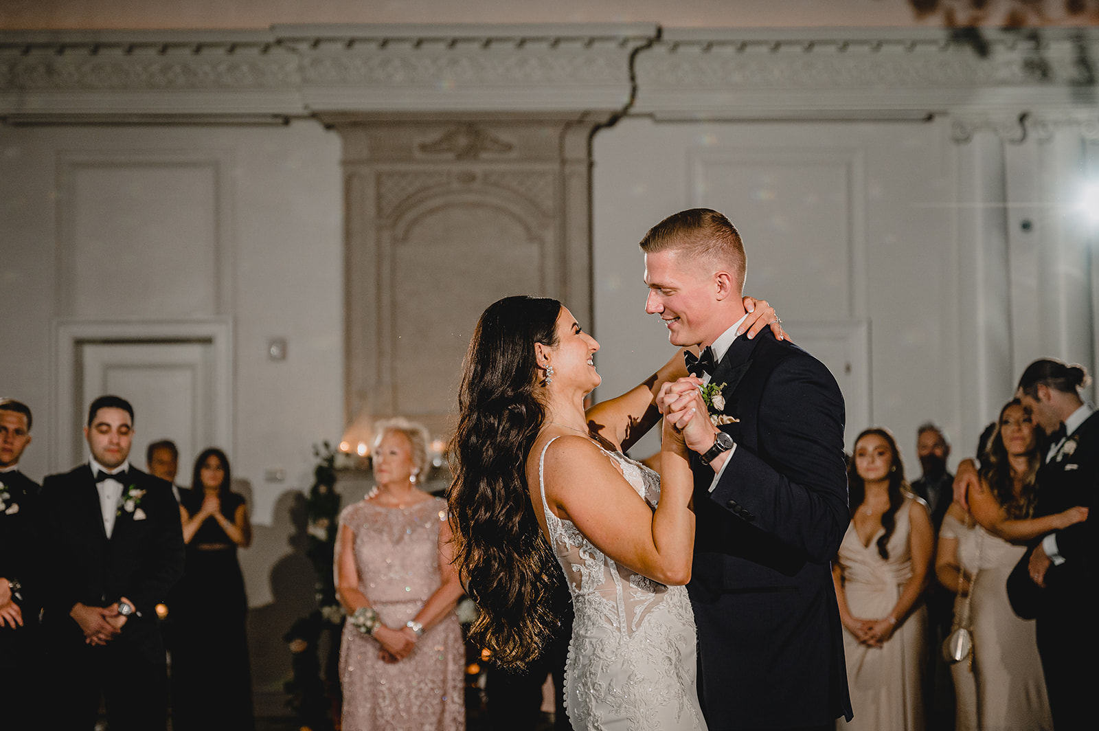 bride and groom dance during NJ wedding reception in ballroom