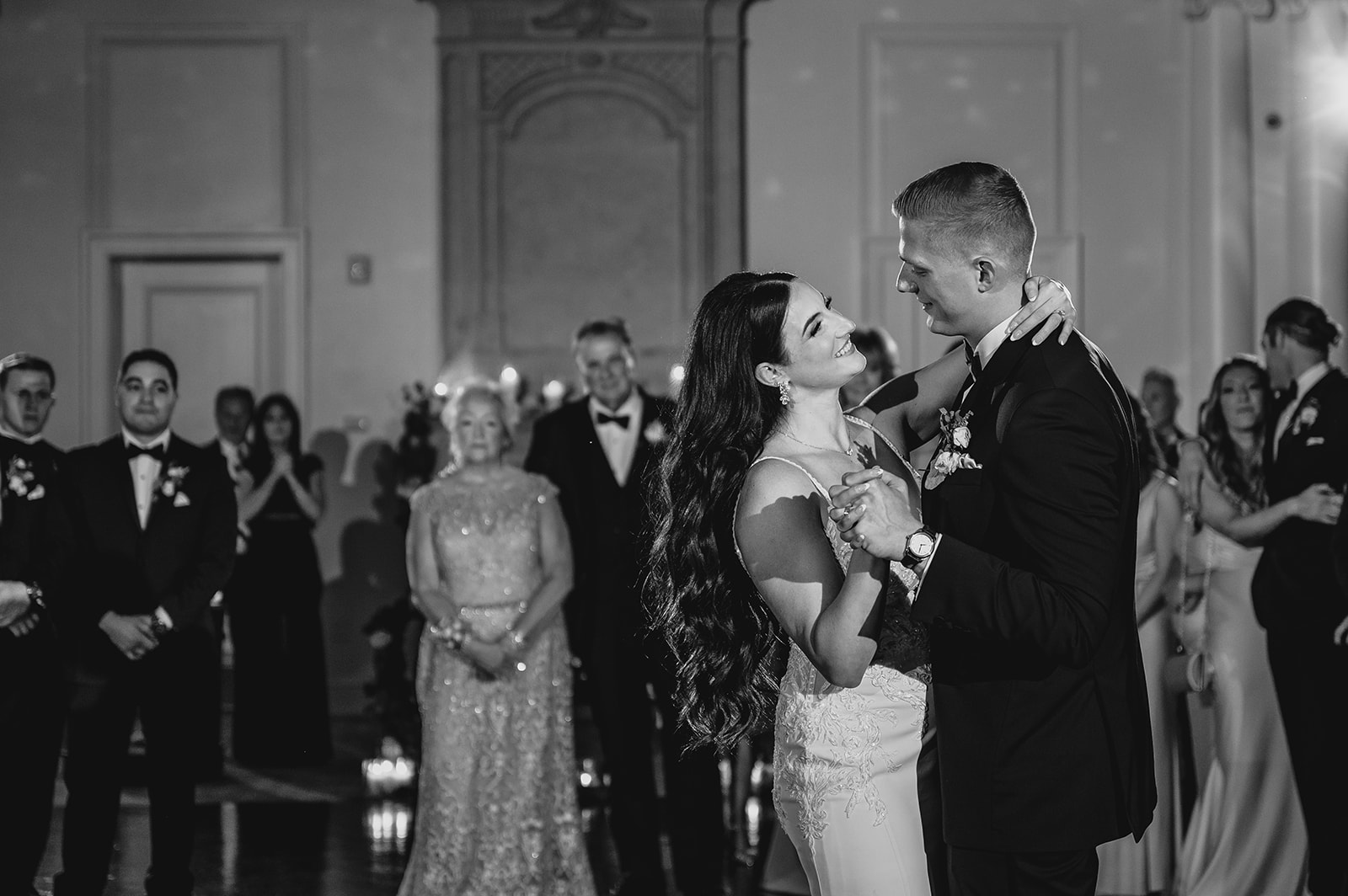bride and groom dance during NJ wedding reception in ballroom
