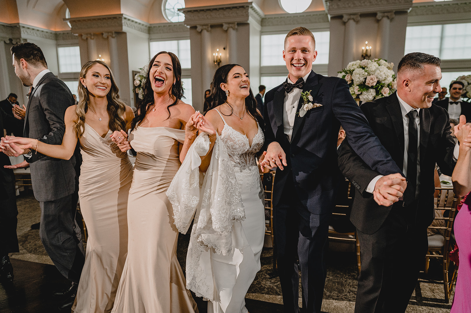 newlyweds dance with bridesmaids and groomsmen at NJ wedding reception