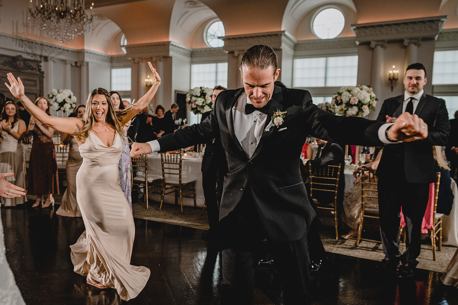 wedding guests dance in ballroom at NJ wedding reception