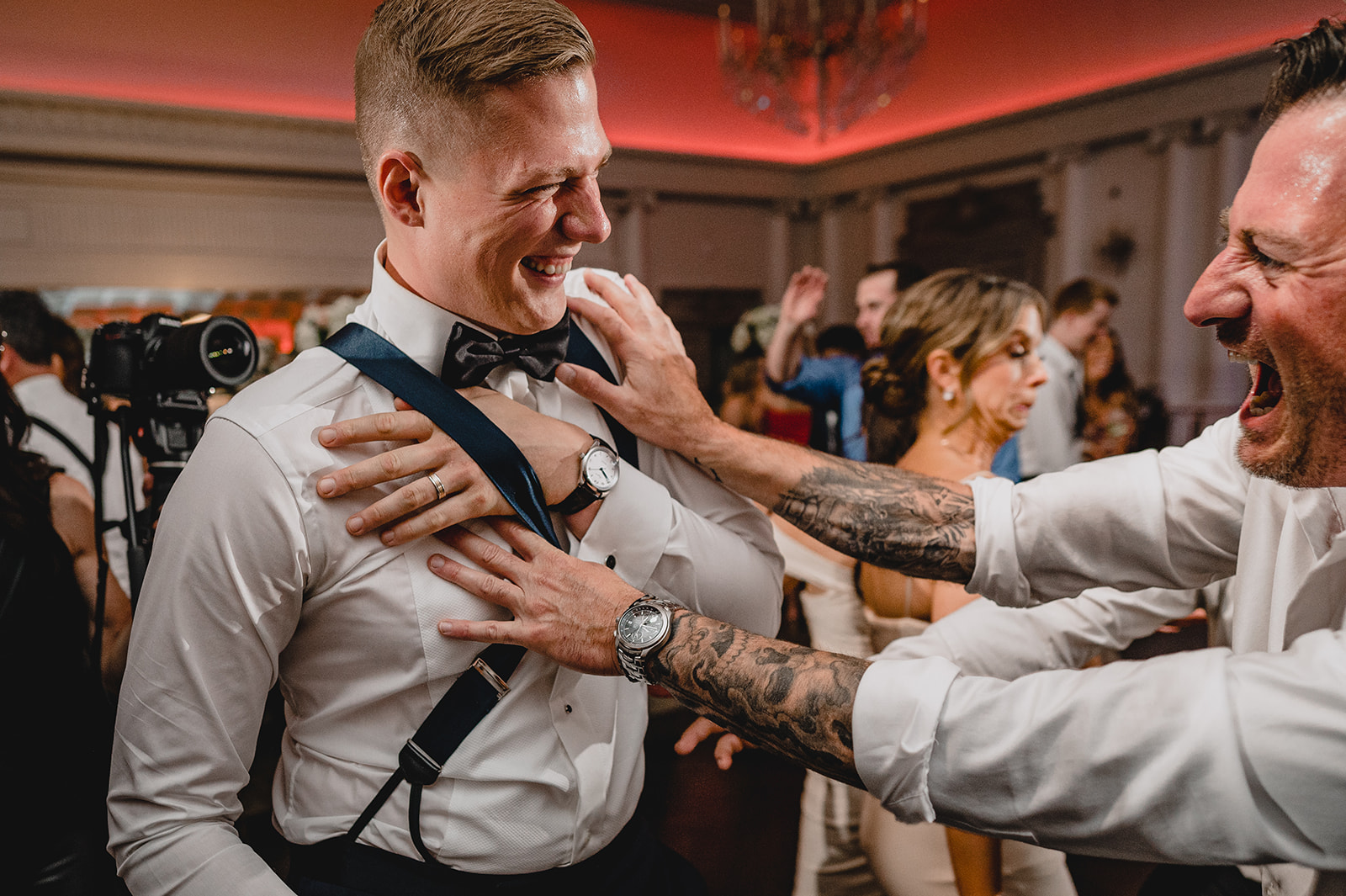 groom dances with groomsmen during NJ wedding reception