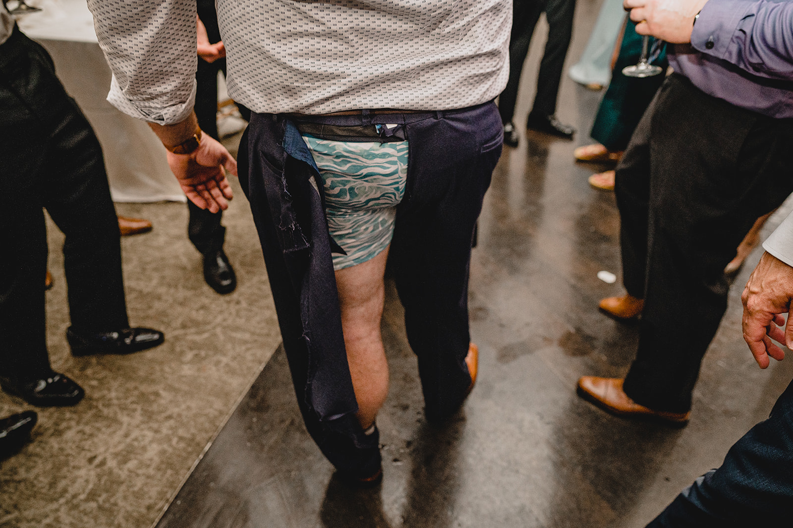 man rips pants during New Jersey wedding day