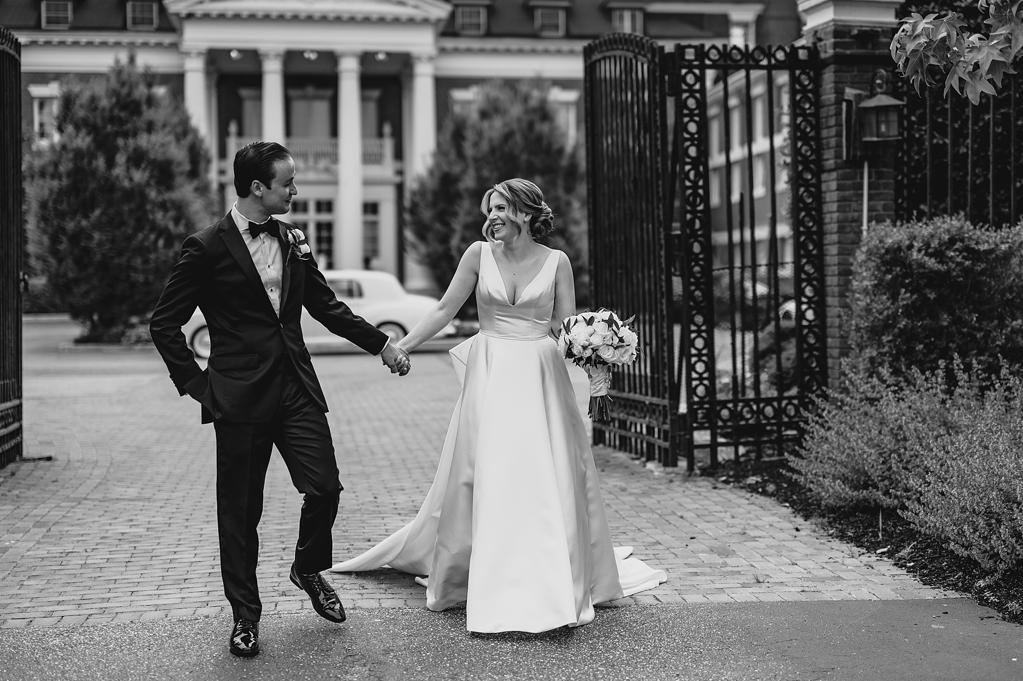bride and groom leave Bourne Mansion