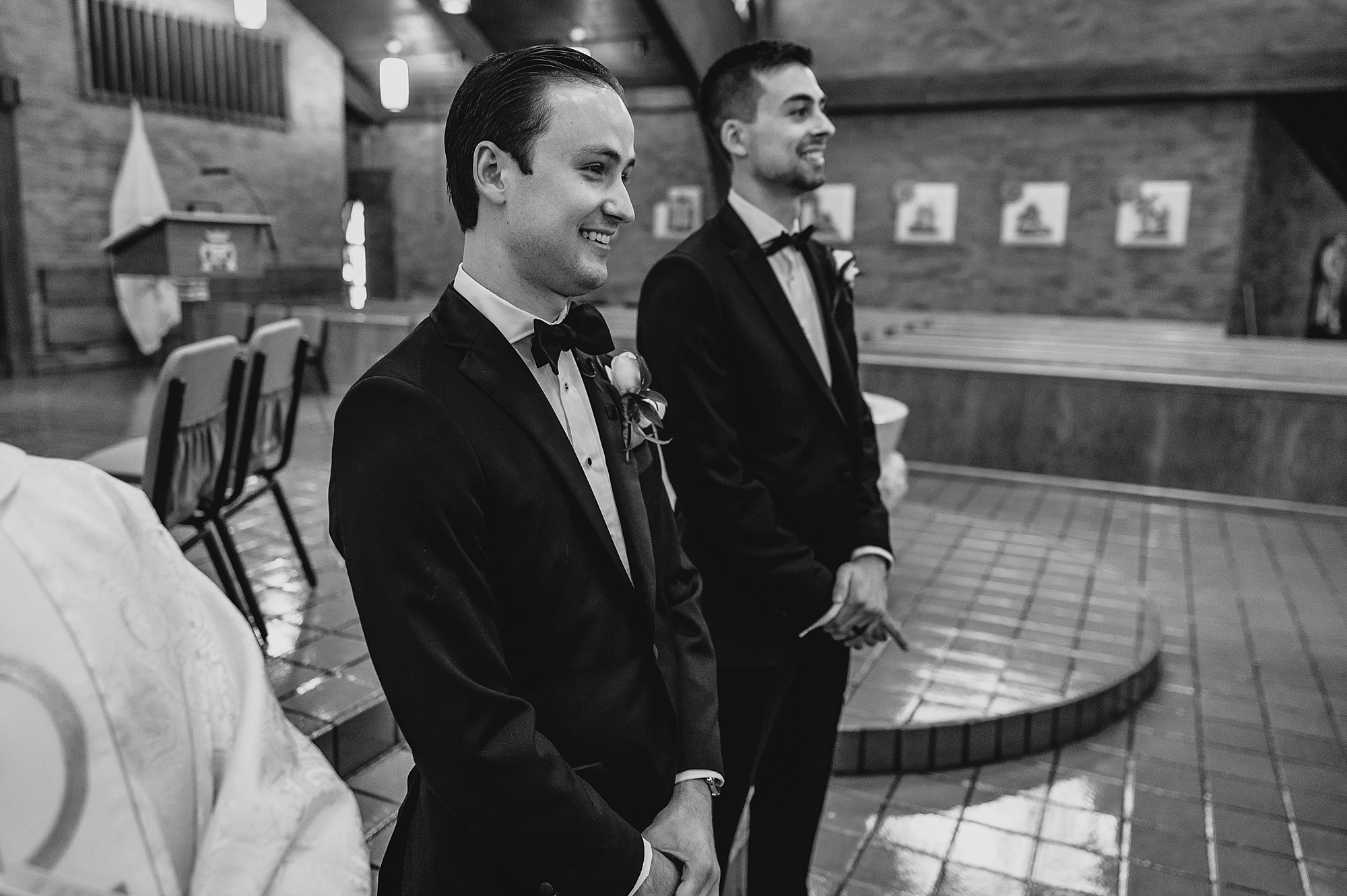 groom watches bride walk down aisle in Long Island NY church 