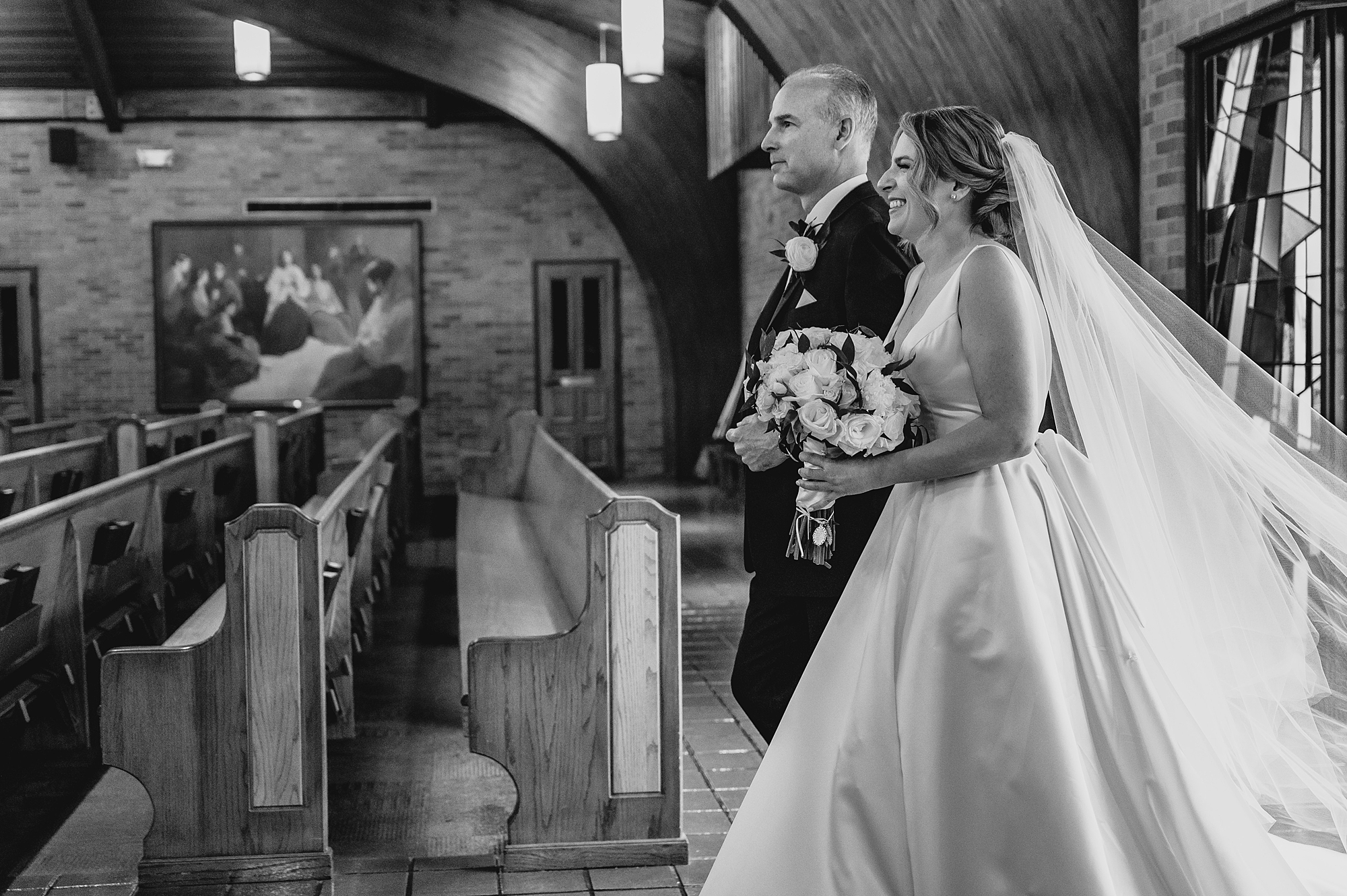 bride walks down aisle in church on Long Island NY