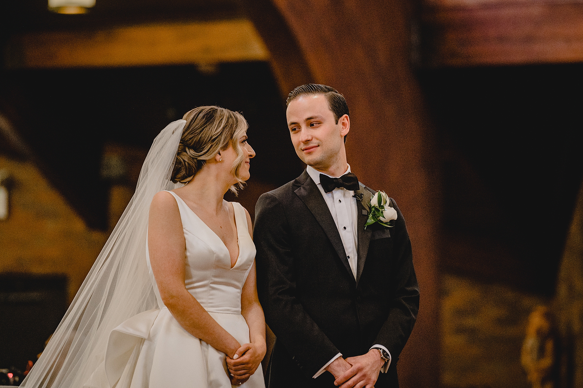 bride and groom smile during traditional church wedding on Long Island NY