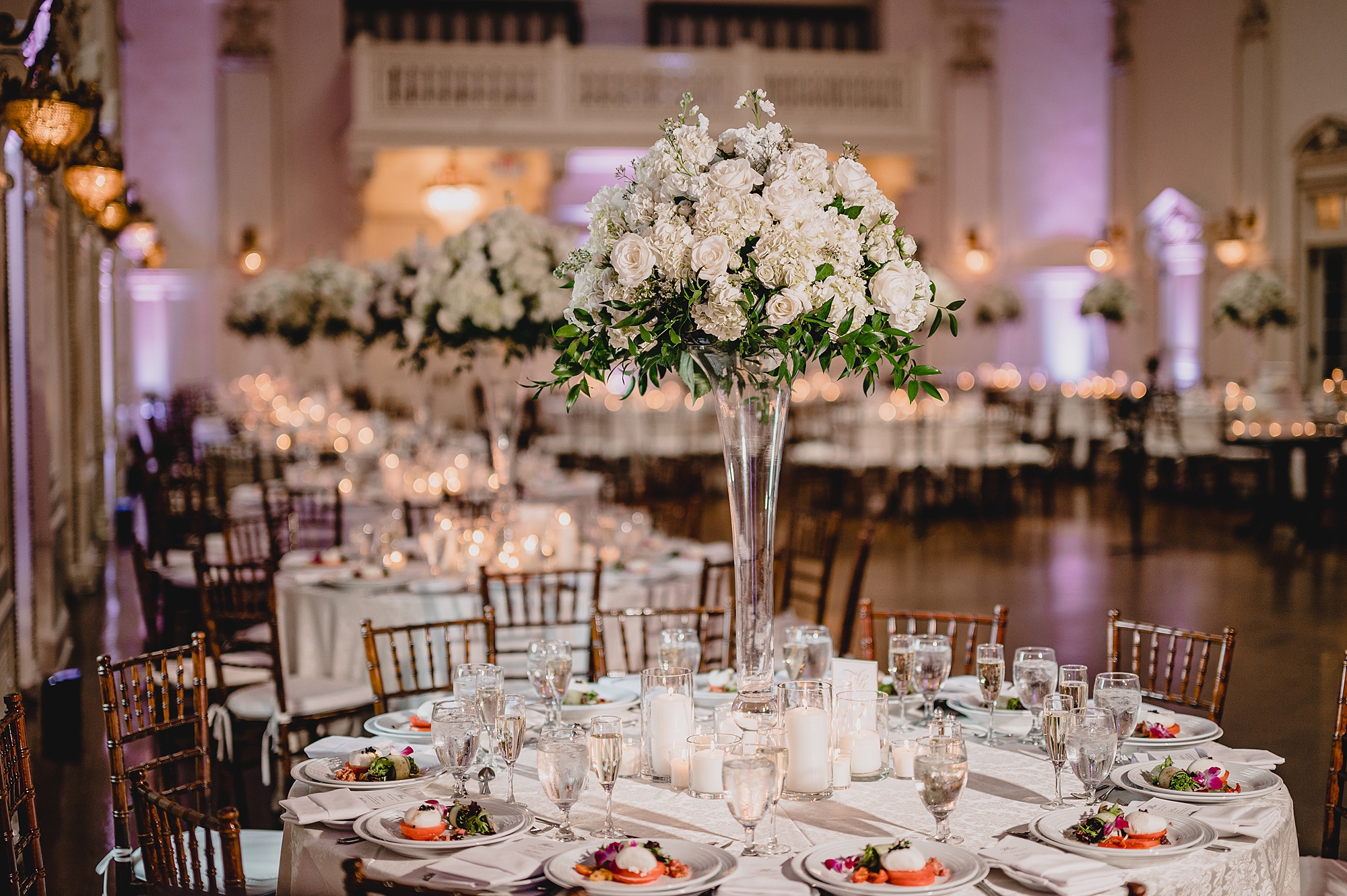wedding reception with white flowers in Bourne Mansion