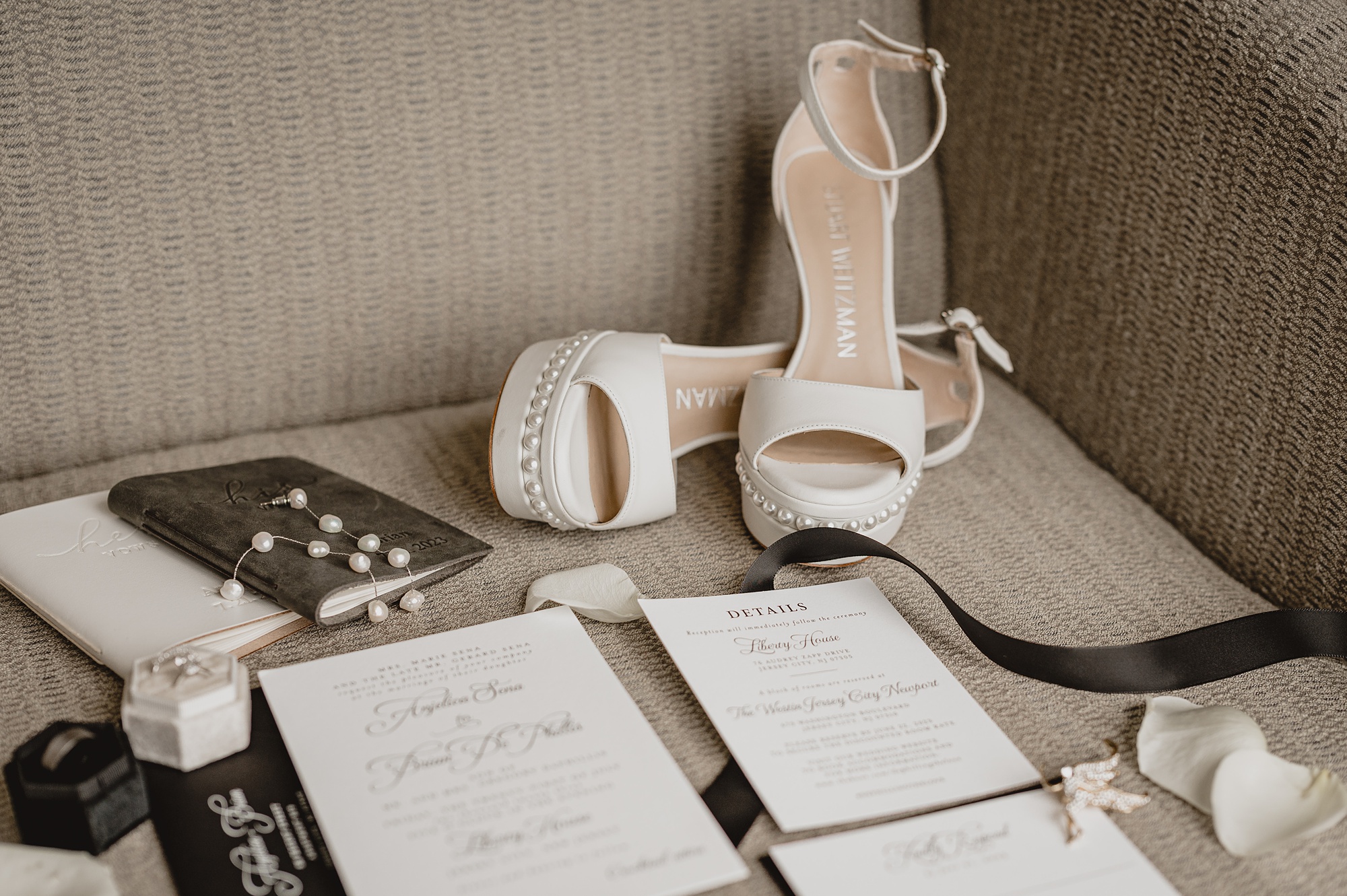 bride's ivory shoes with black and white invitation suite