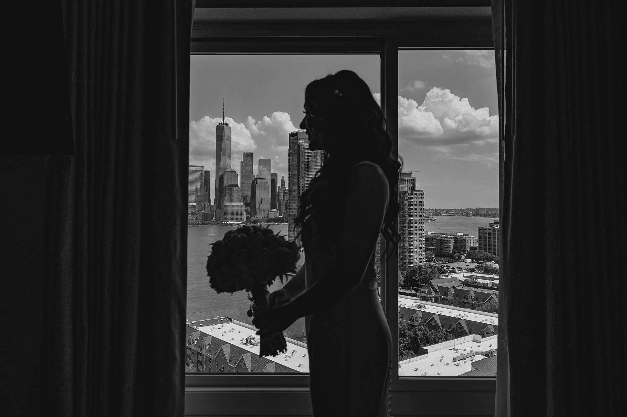 silhouette for bride in front of window at New Jersey hotel room